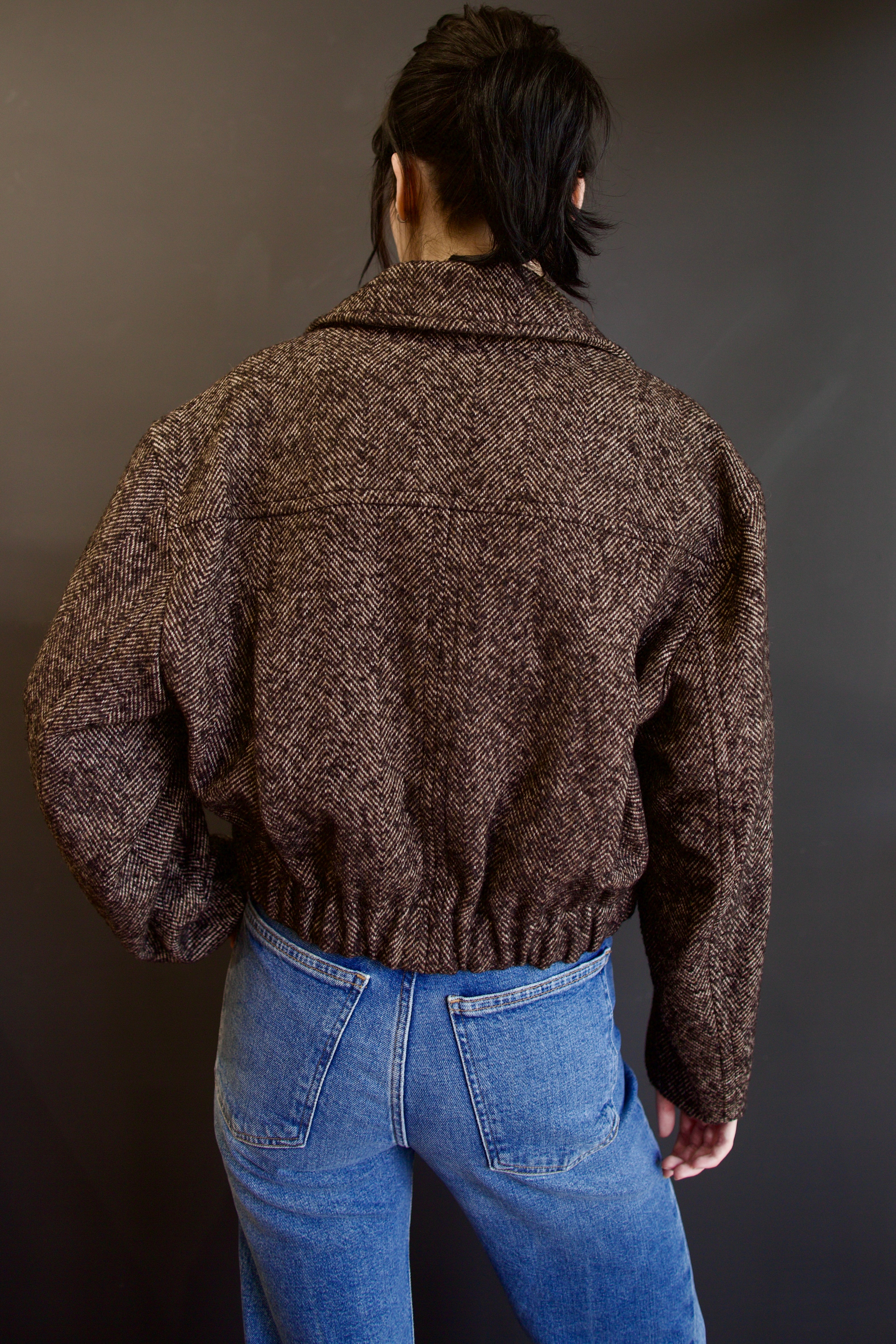 Back of Apiece Apart Ria cropped jacket in a brown textured herringbone and gathered waistband