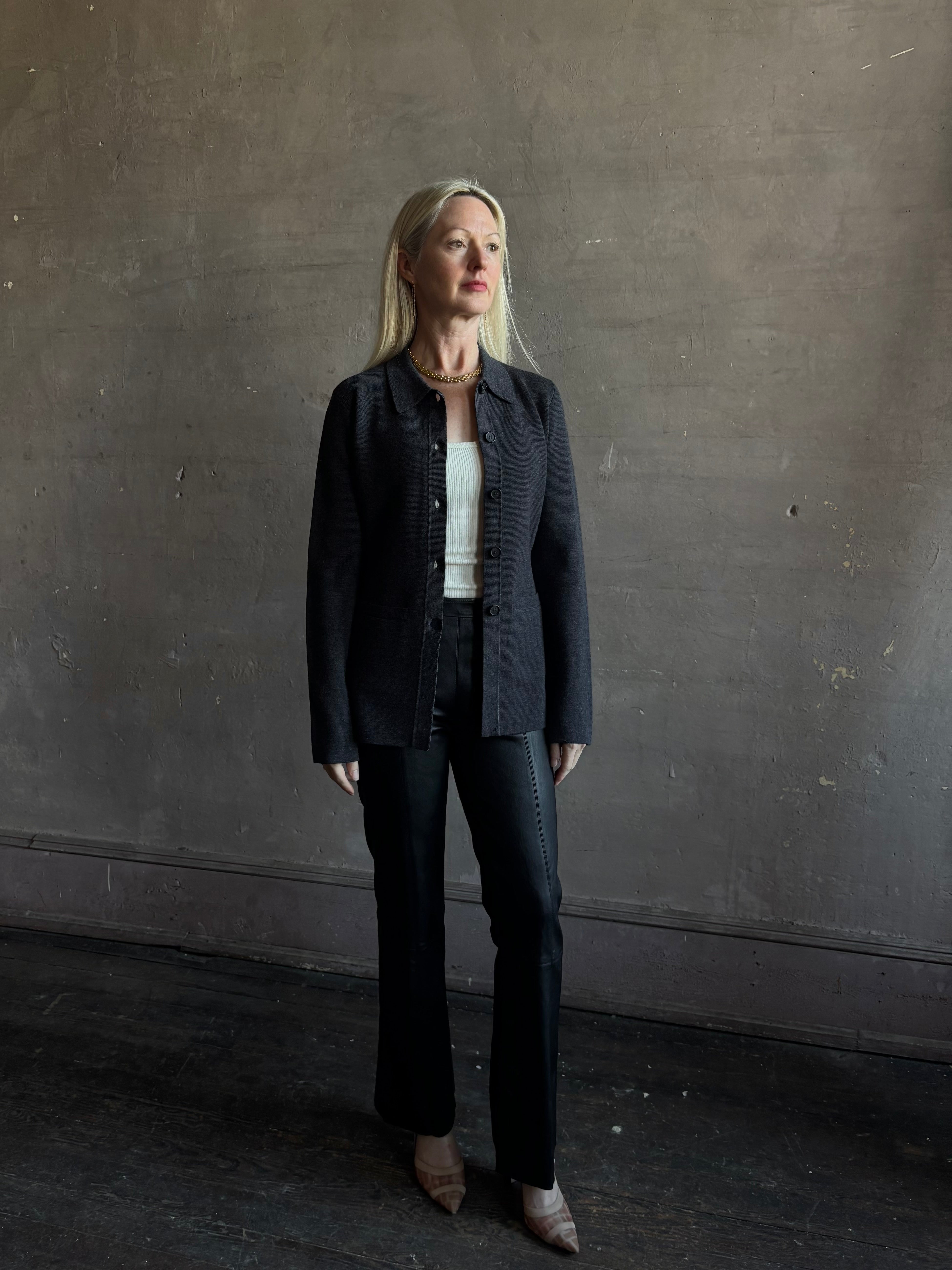 Mature woman wearing Apiece Apart Betti Knit Cardigan in Grey merino wool collared jacket-style silhouette front pockets everyday layering