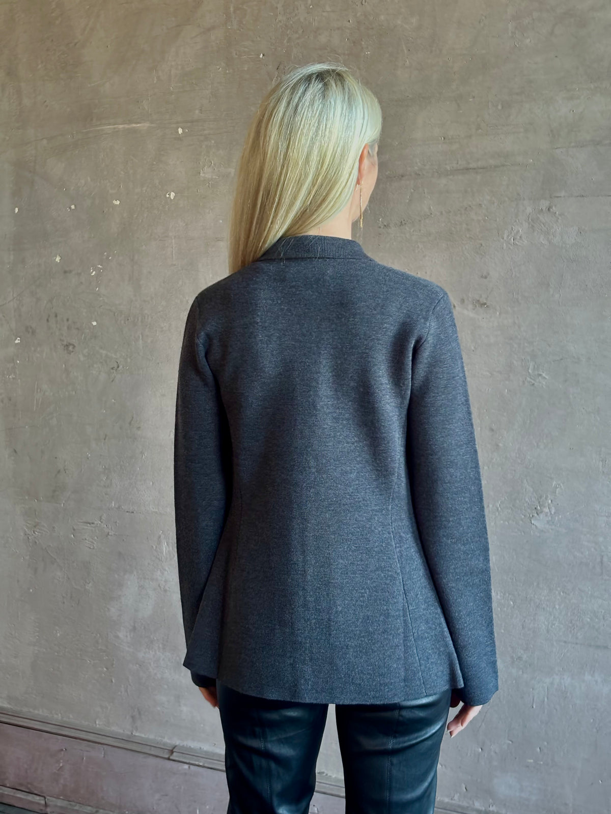 Mature woman wearing Apiece Apart Betti Knit Cardigan in Grey merino wool collared jacket-style silhouette front pockets everyday layering