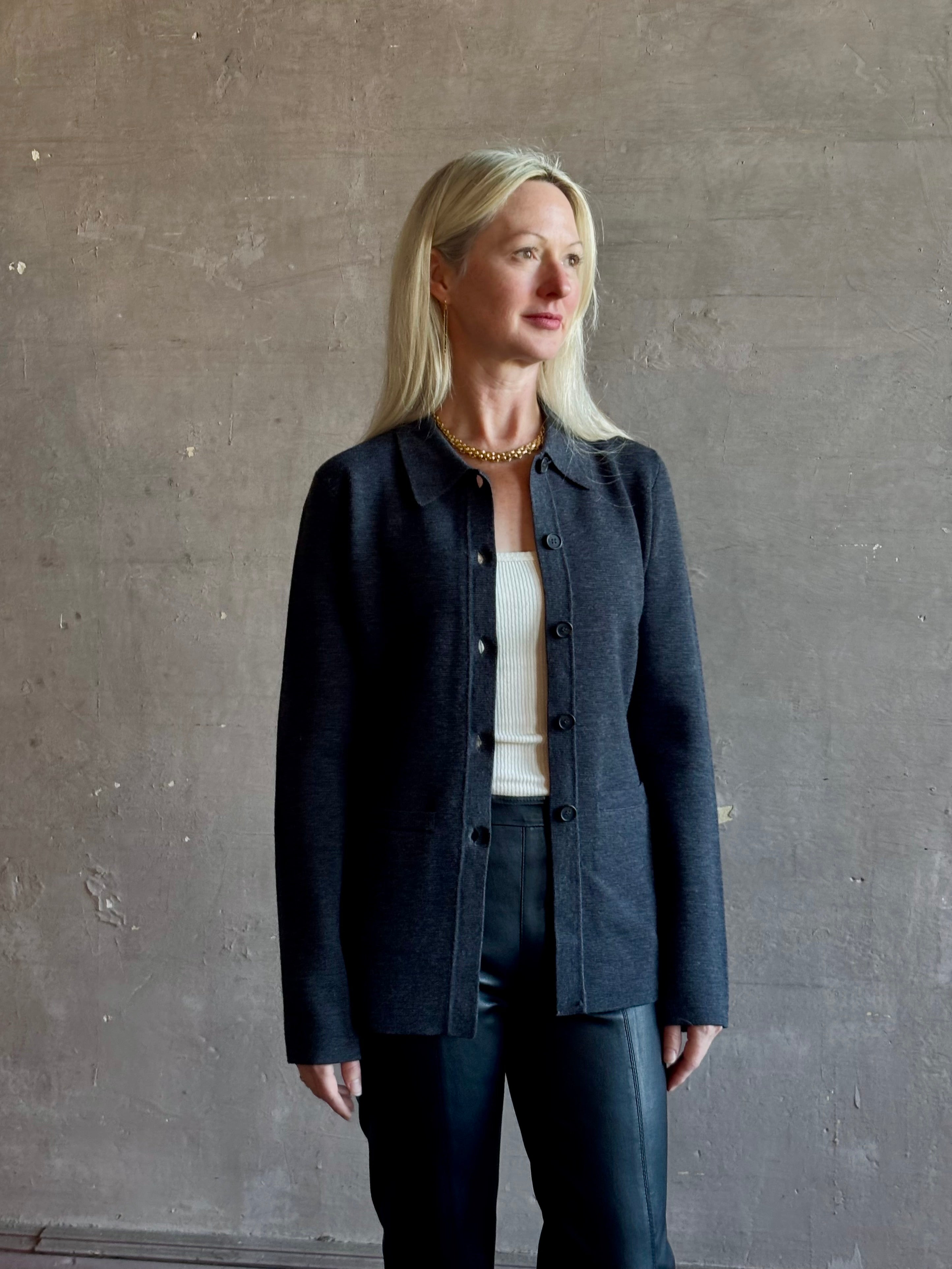 Mature woman wearing Apiece Apart Betti Knit Cardigan in Grey merino wool collared jacket-style silhouette front pockets everyday layering