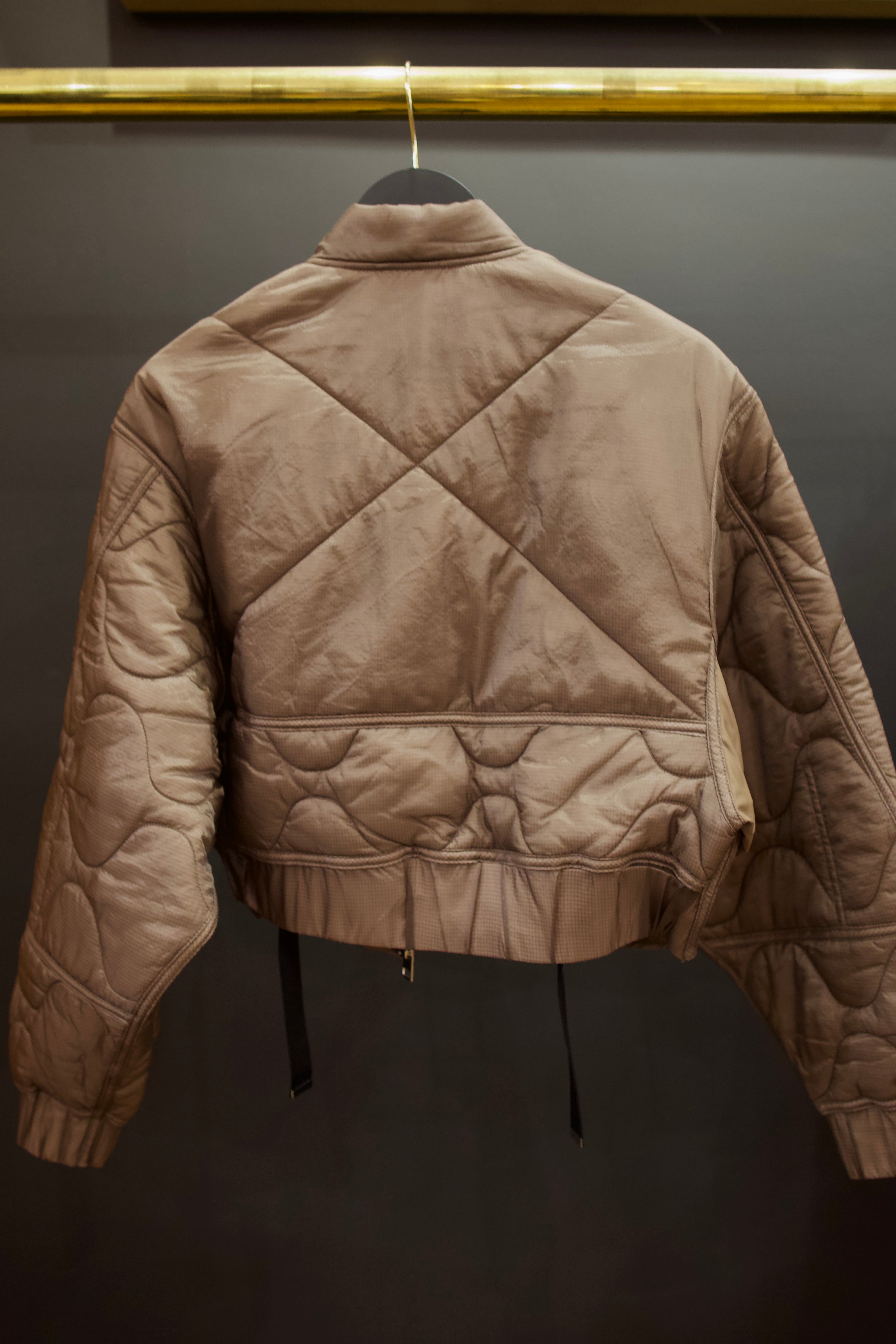 Agolde Iona quilted jacket in brown beautifully designed with circular and x stitch details on back with gathered waist