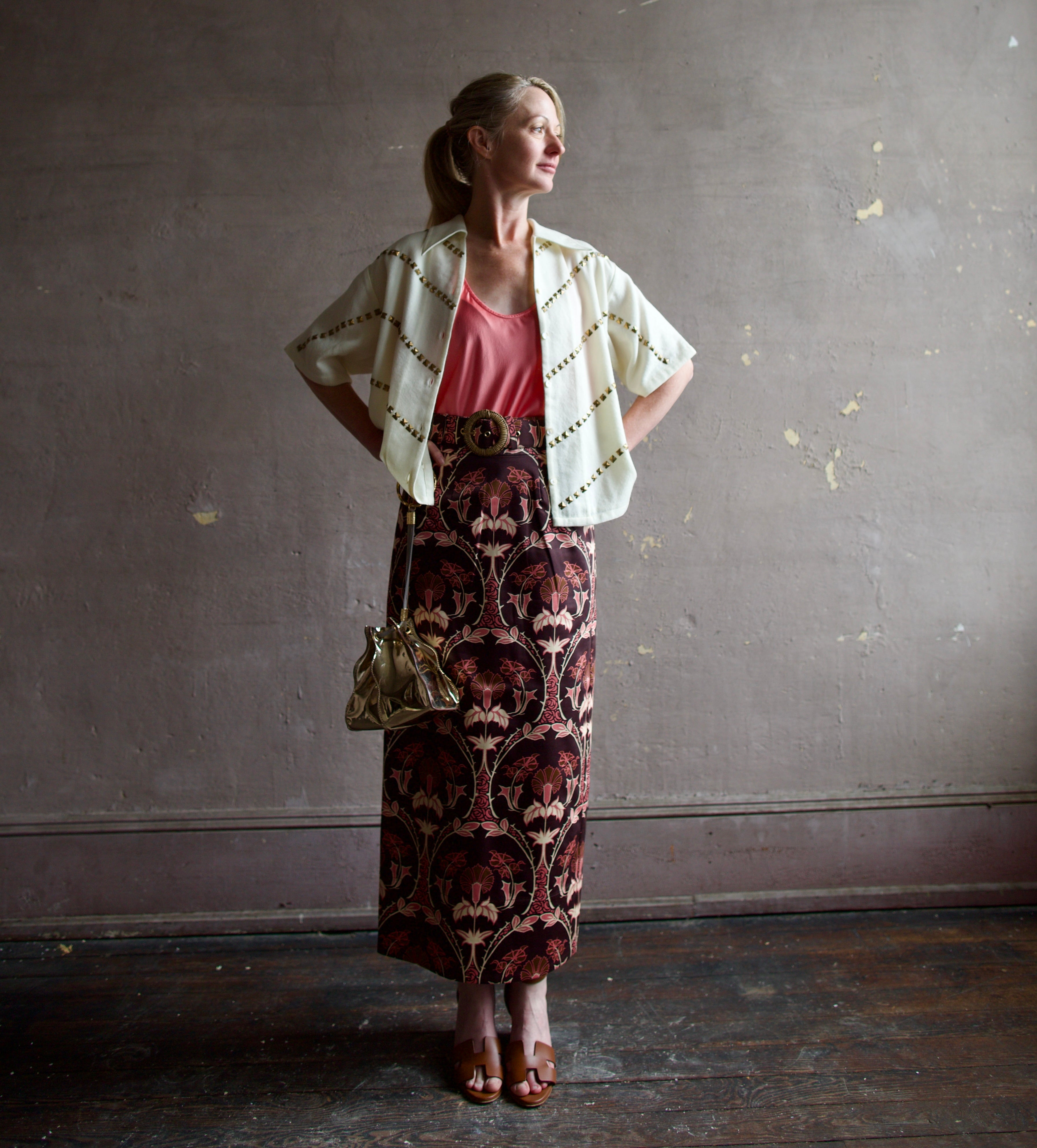 Image of a woman wearing the Alix of Bohemia Studded Shirt, Forte Forte Silk Tank and Cara Cara Printed Skirt