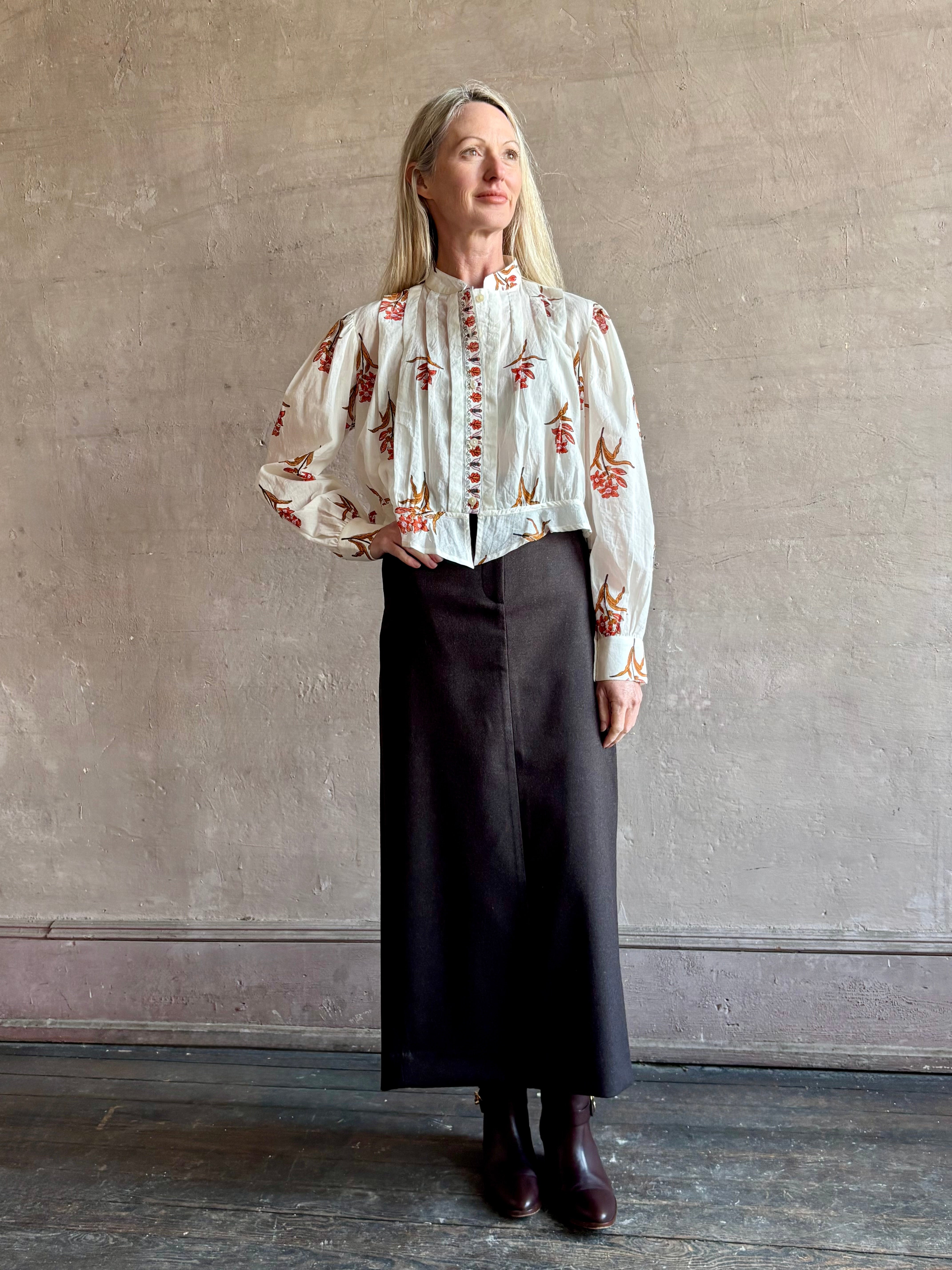 Image of woman Alix of Bohemia Ryland Persimmon Flower Shirt with long sleeves, button front, a mandarin collar and cropped
