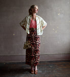 Mature woman wearing Alix of Bohemia Stevie Studded wool top open for warm layering over tank top and luxe look