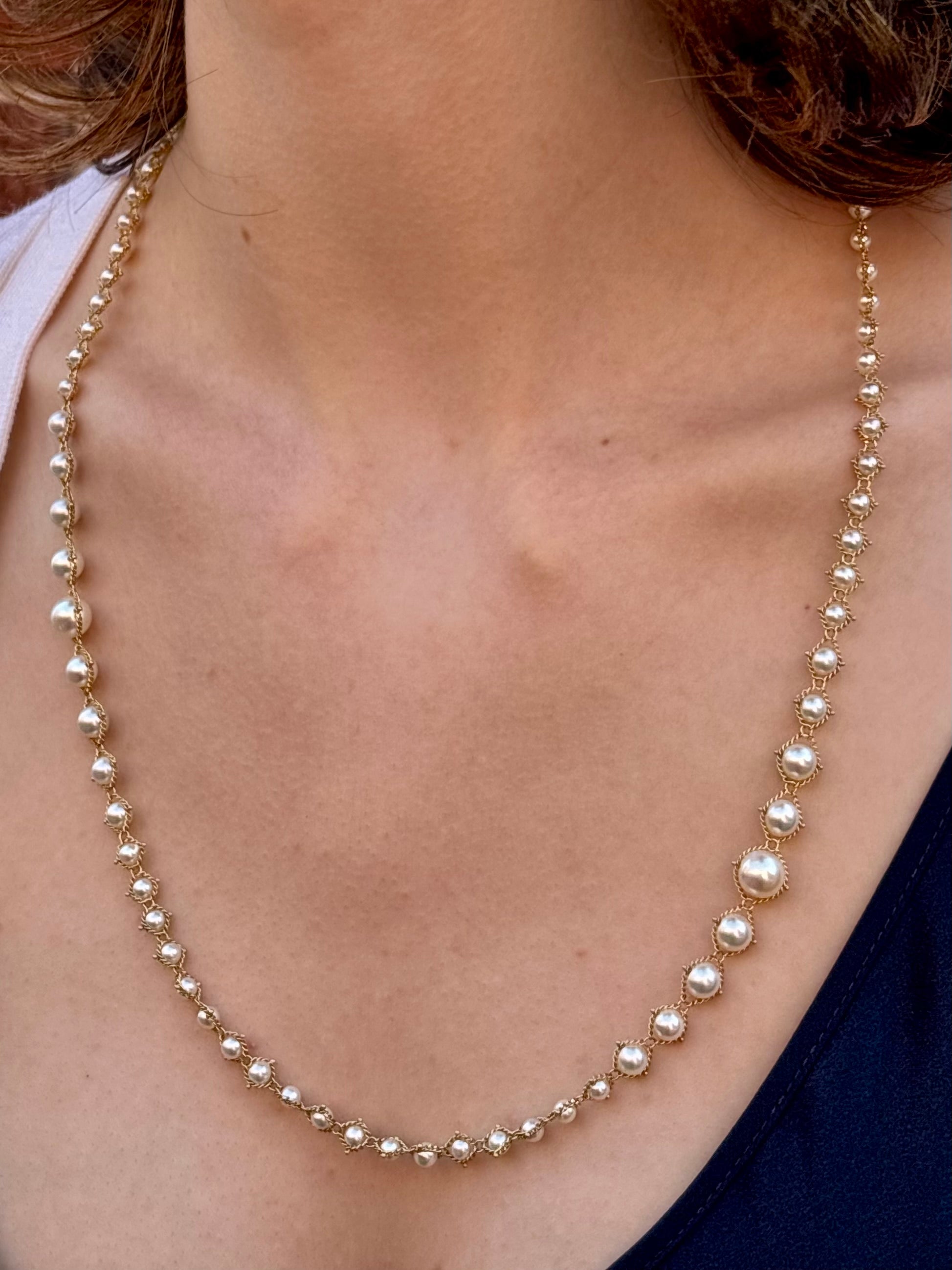 Woman wearing luxury designer Amali  hand woven long Akoya Pearl and 18k yellow  gold Necklace made in USA fine jewelry