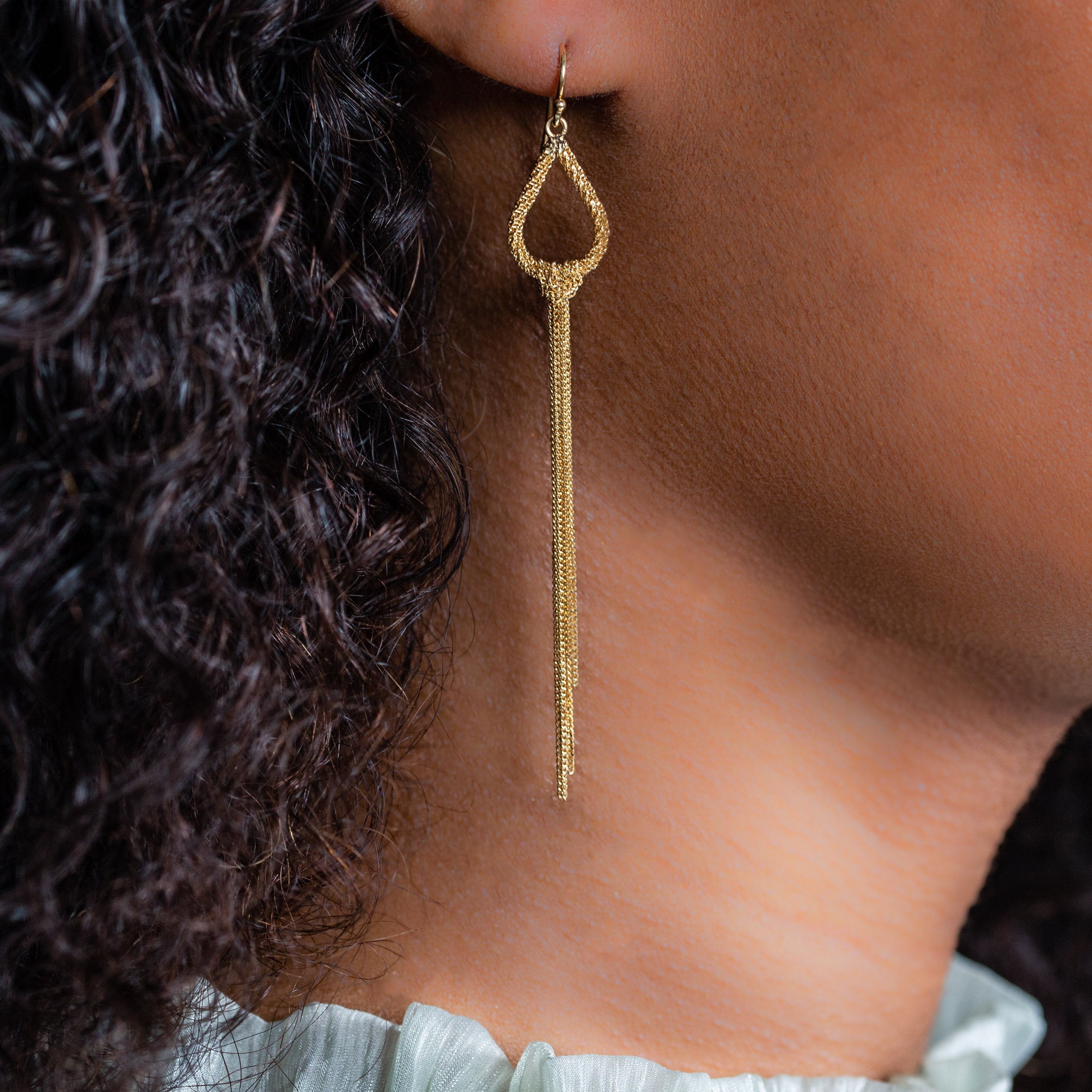 Woman wearing luxury designer Amali Knotted Marquis 18k yellow gold Earrings made in USA Fine Jewelry