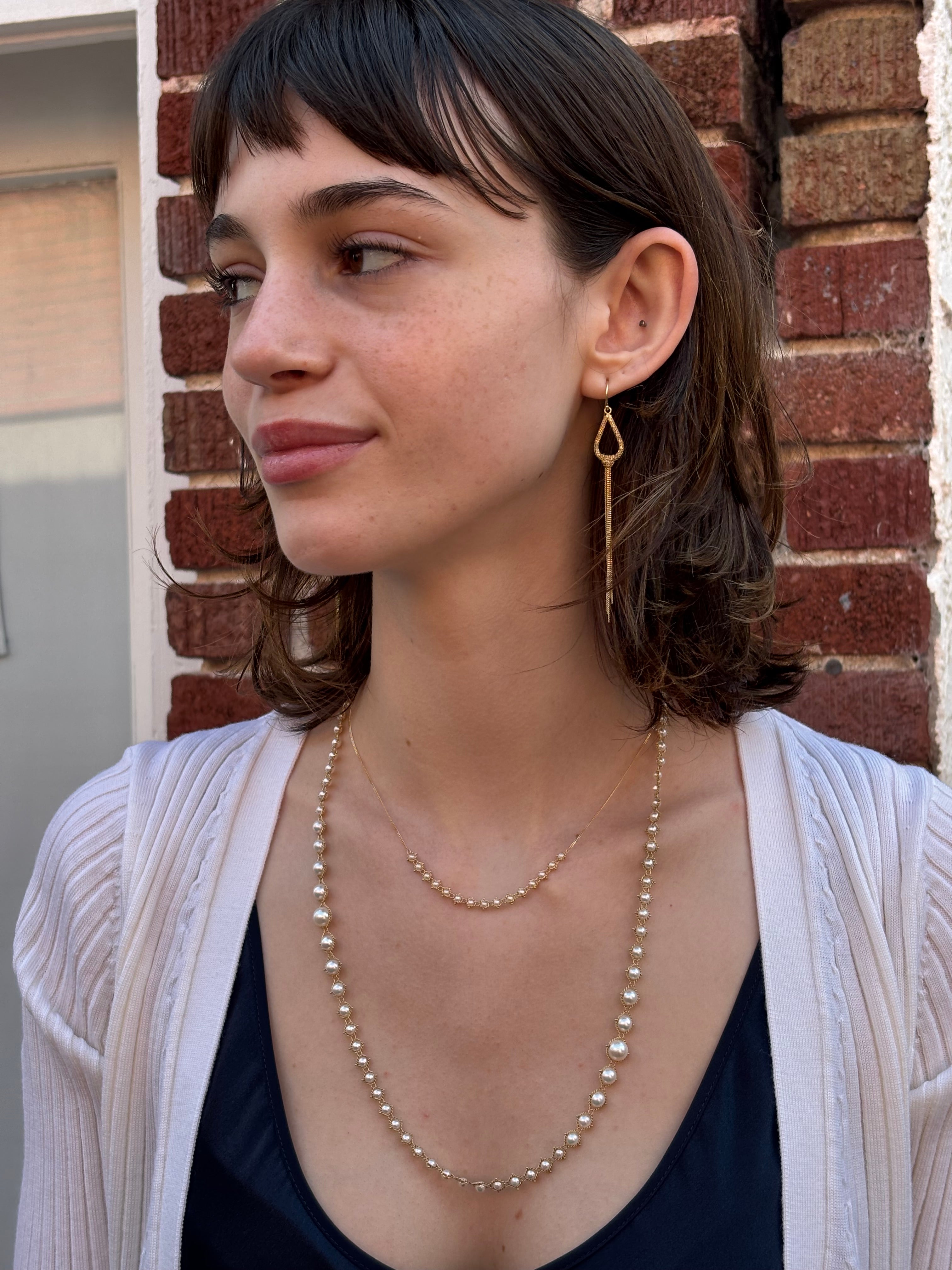 Woman wearing luxury designer Amali freshwater Pearl and 18k yellow gold Necklace fine jewelry handmade in USA 