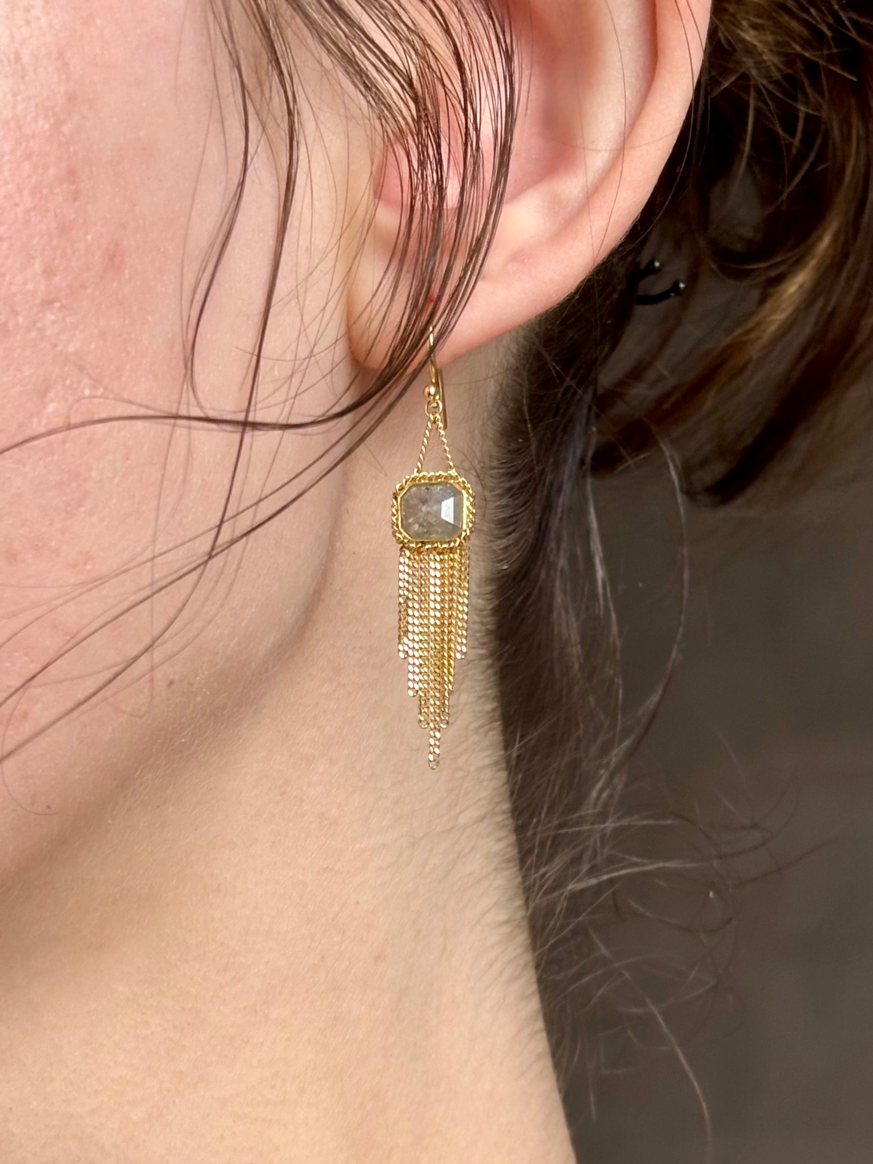 Woman wearing Amali Tassel silver diamond drop Earrings in 18k yellow gold in an inspiring 21st century modern design