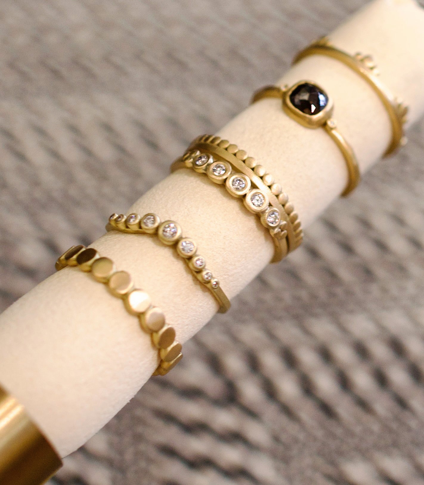 Image of Ananda Khalsa handmade 18kt hammered matte gold ring featuring five white diamond setting expertly crafted