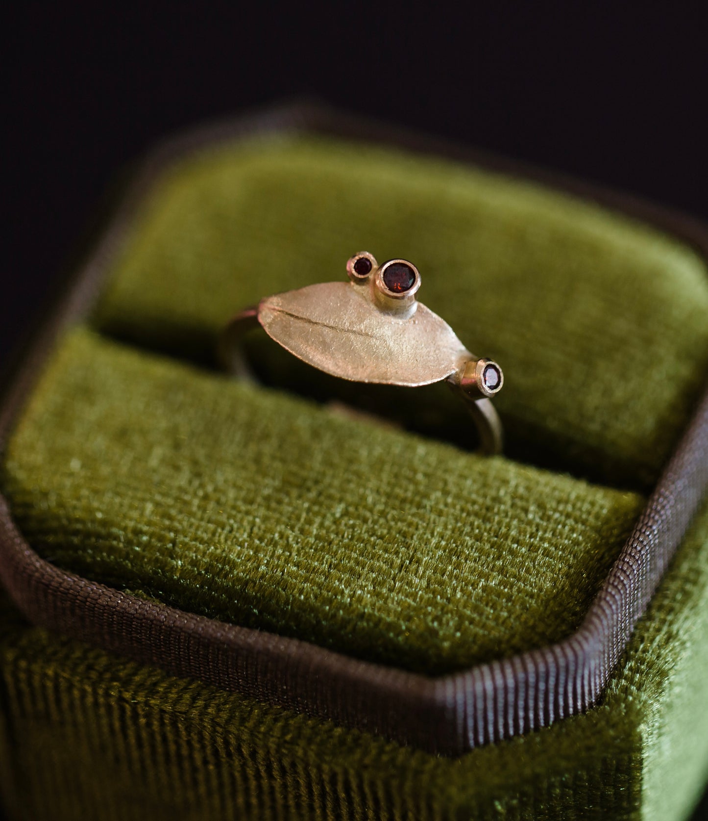 Image featuring North Carolina artist Anna Johnson14k Pink Diamond Kalmia Ring with 0.1ctw natural pink diamonds with a cast mountain laurel leaf.