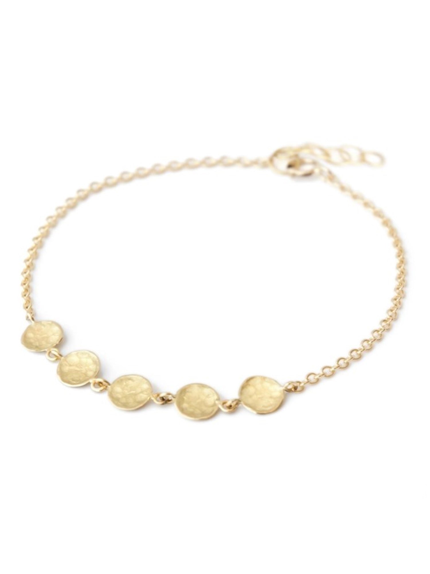 Image featuring bracelet by artist Anne Sportun fabricated in 18k yellow gold with 5 hammered gold discs 