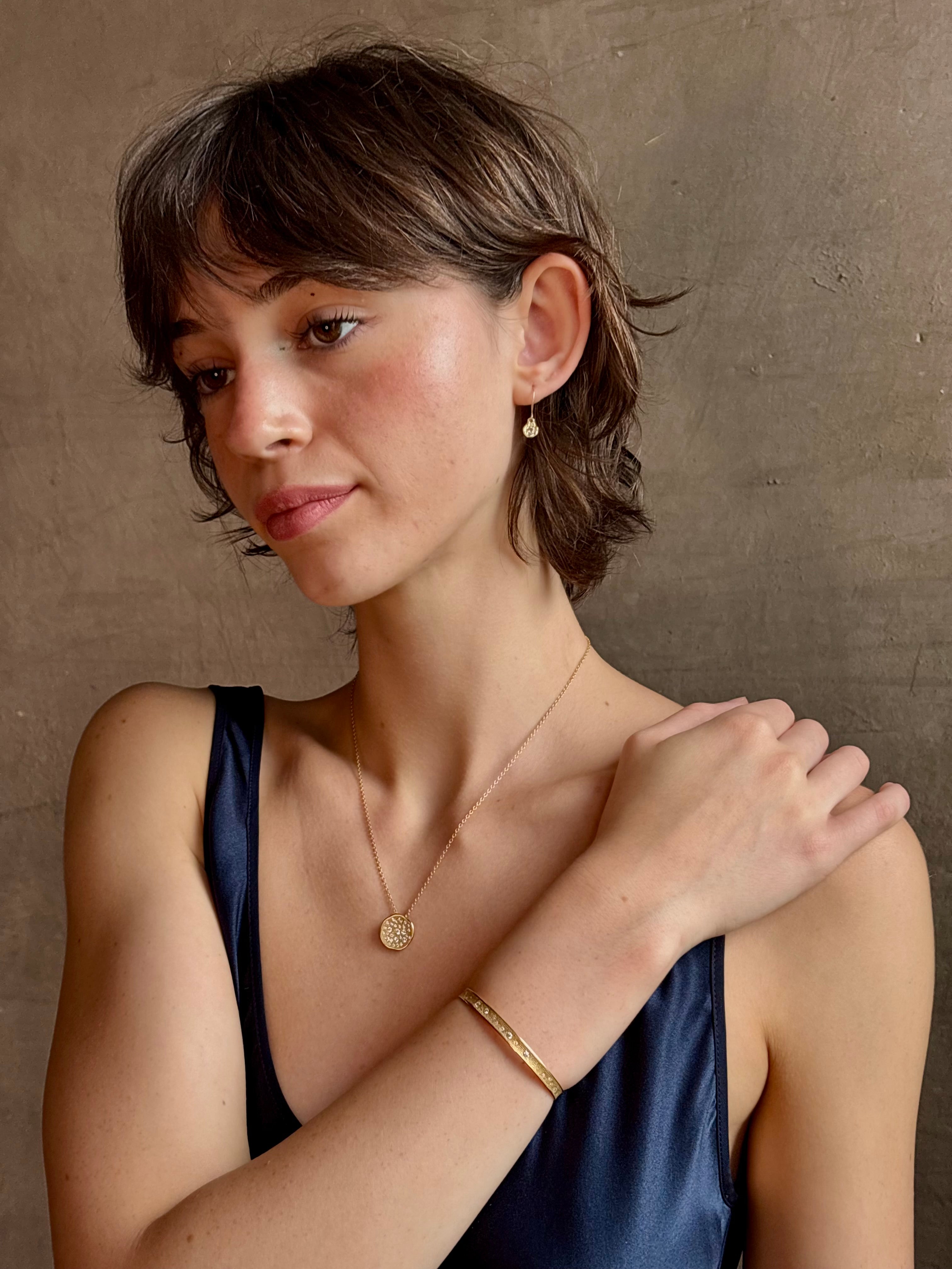 18k yellow gold diamond cuff by fine jewelry artist Anne Sportun with 31 round brilliant cut G/VS diamonds 