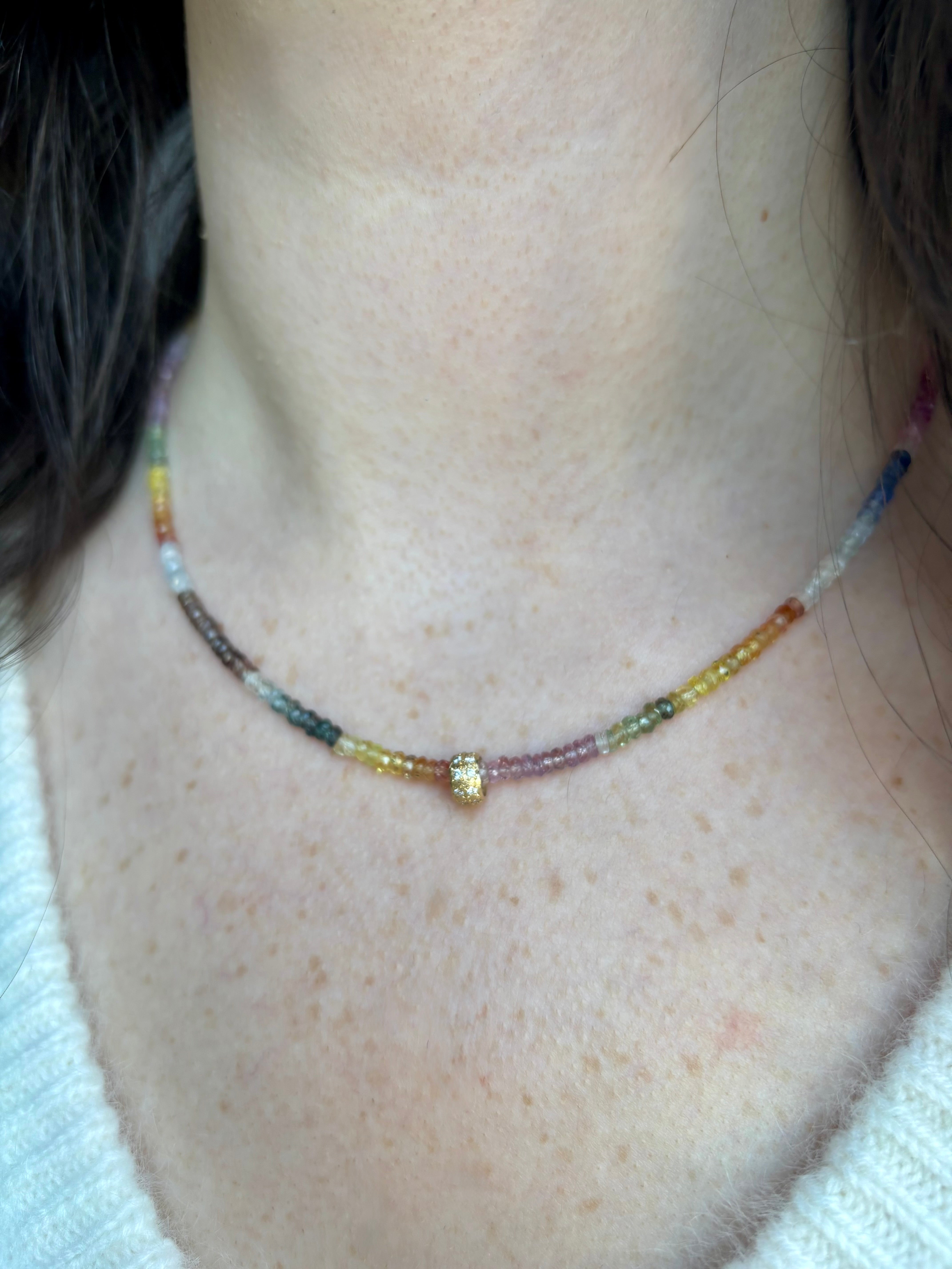 Close up image of woman wearing fine jewelry designer ANNE SPORTUN Multi-Sapphire and Diamond Necklace in 18K Yellow Gold 