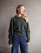 Image of woman wearing the Apiece Apart  Alina Dolman Sweater and Re/Done Wide Leg Crop Jeans