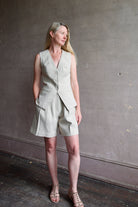 Image of a woman wearing the Apiece Apart Helena Vest and Linaza Shorts