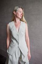Image of a woman wearing the Apiece Apart Helena Vest and Linanza Short