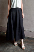 Image of a woman wearing the Apiece Apart Primavera Drape Skirt