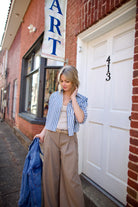 Mature woman wearing Apiece Apart Pia denim jacket with a button front long sleeves oversized fit great for layering 