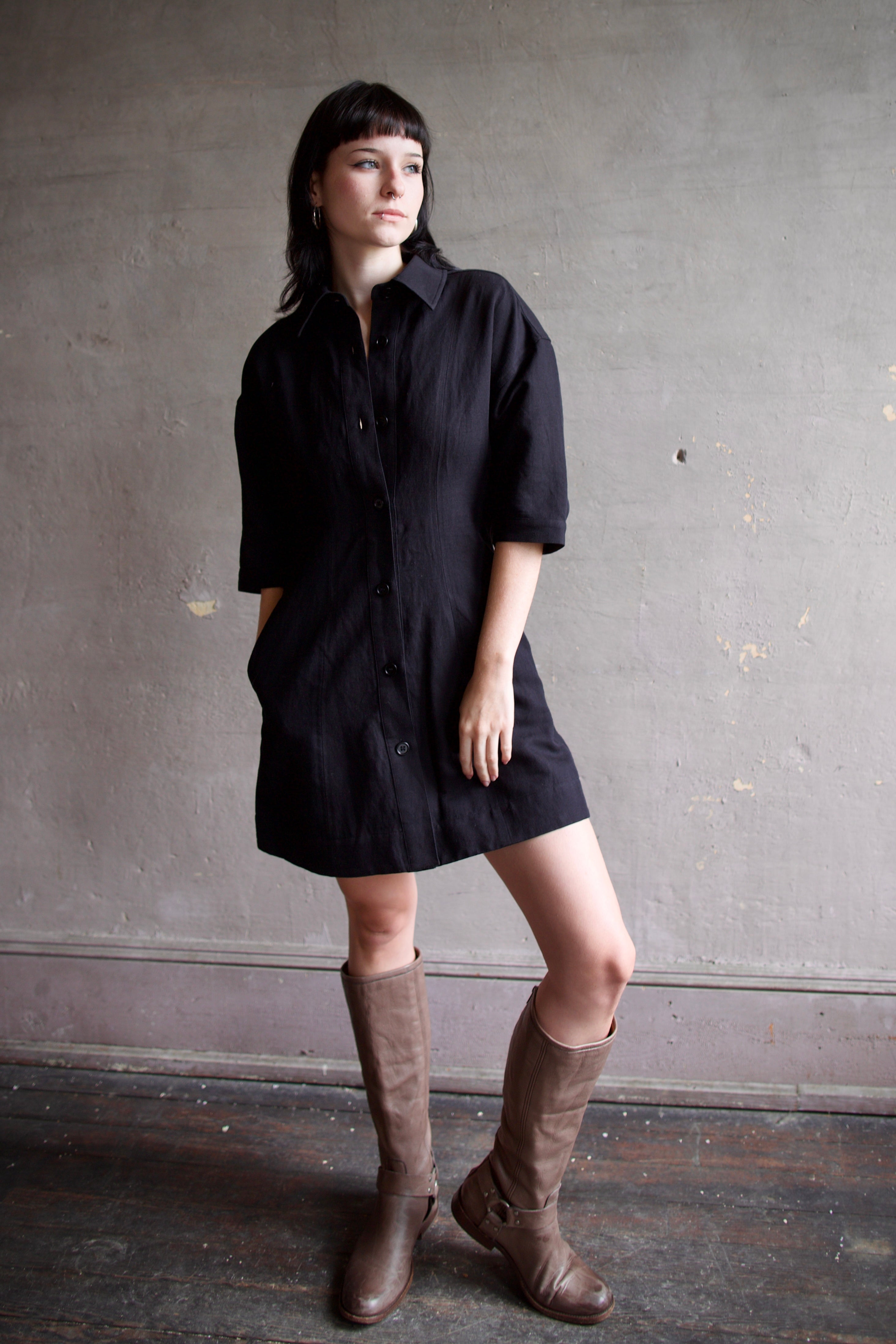Model wearing comfortable Apiece Apart Luz black shirt mini dress with 3/4 sleeves in cotton and linen mix