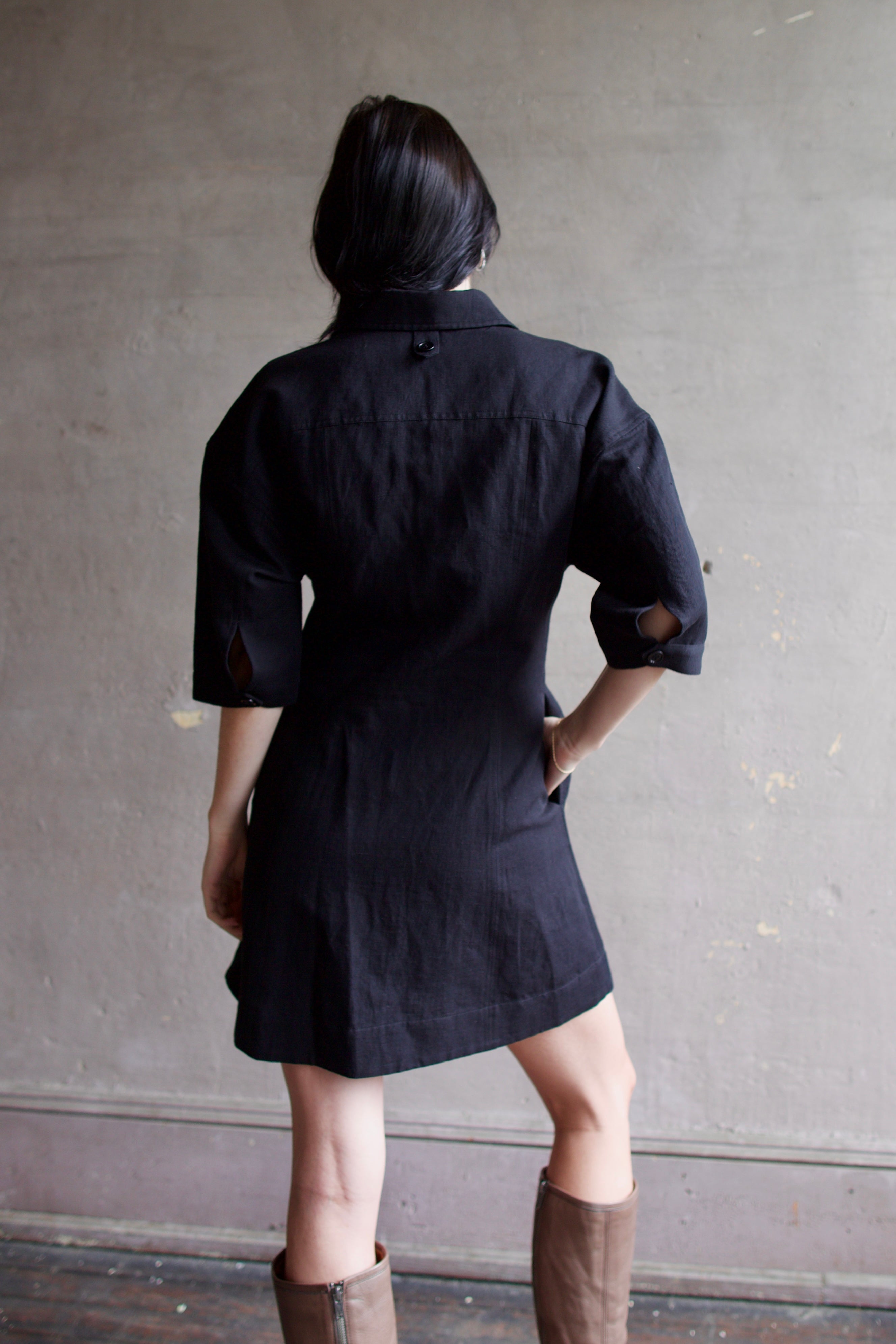 Model wearing comfortable Apiece Apart Luz black shirt mini dress with 3/4 sleeves in cotton and linen mix