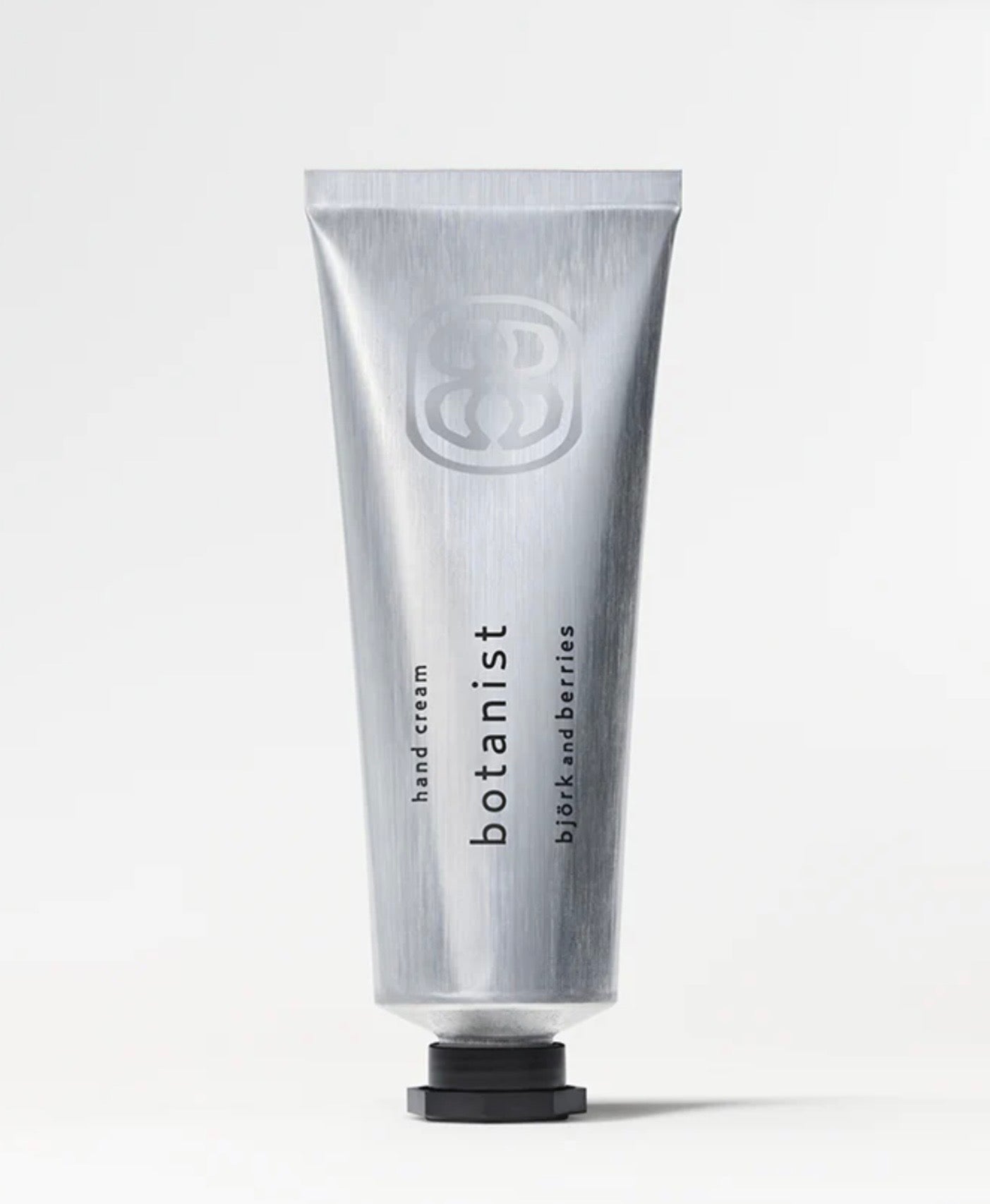 Image of BJORK AND BERRIES Botanist luxury personal fragrance hand lotion with notes of green apple, vetiver and patchouli in an aluminum tube