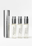 Image of the bjork and berries luxury Swedish eau de parfume trio travel set featuring white forest, fjallsjo and botanist personal fragrances and a sleek stainless steel carry case