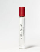 Image of BJORK AND BERRIES White Forest luxury personal fragrance perfume oil with notes of Bergamot, Tonka Bean and Vetiver in a Scandinavian minimalist design clear glass bottle and red lid