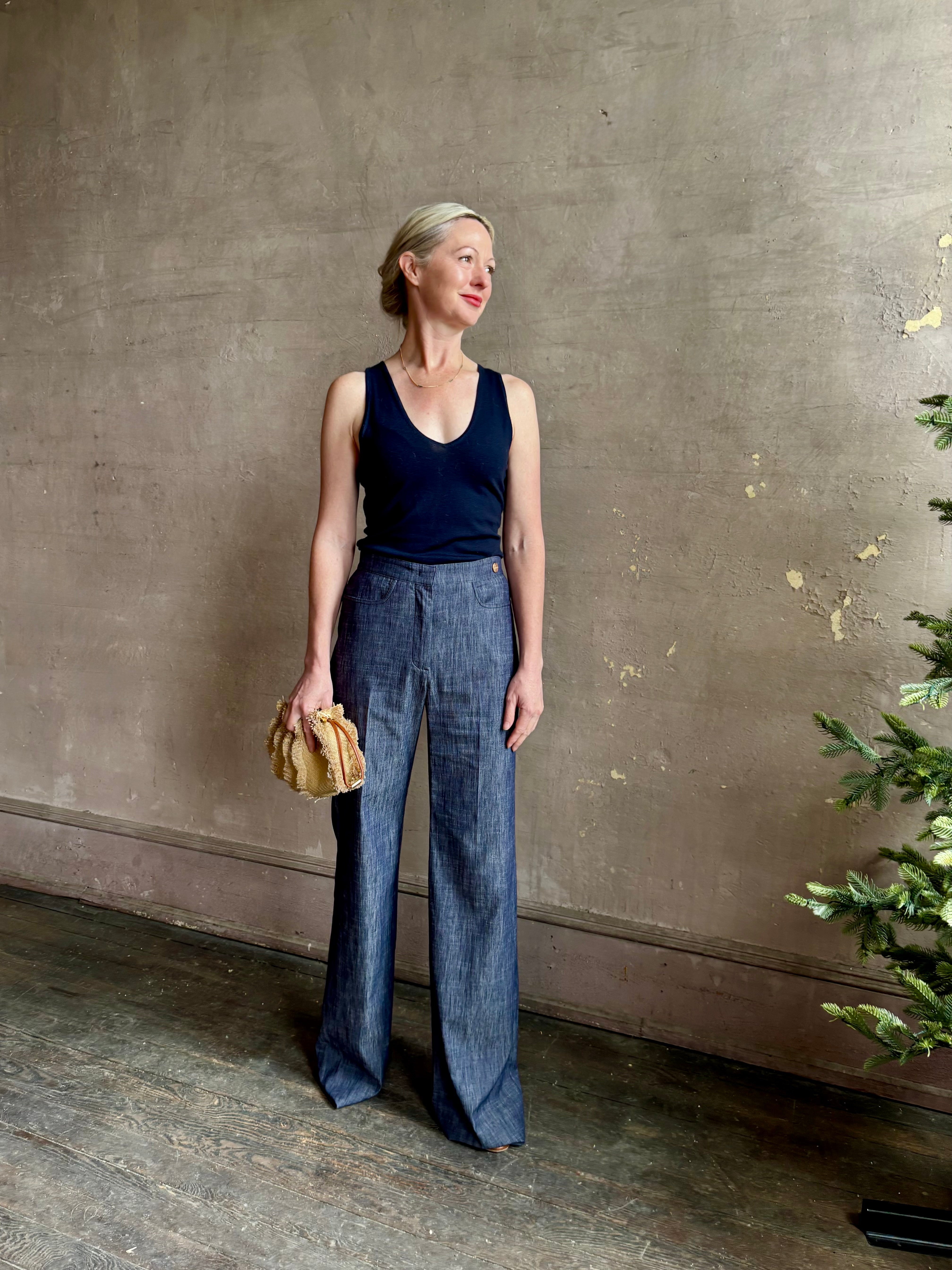 Mature woman wearing Italian designer Tonne trouser from Callas rendered in a dark indigo and crafted from a viscose, polyester, and linen blend with beautiful fluid draping and effortless versitility similar to denim