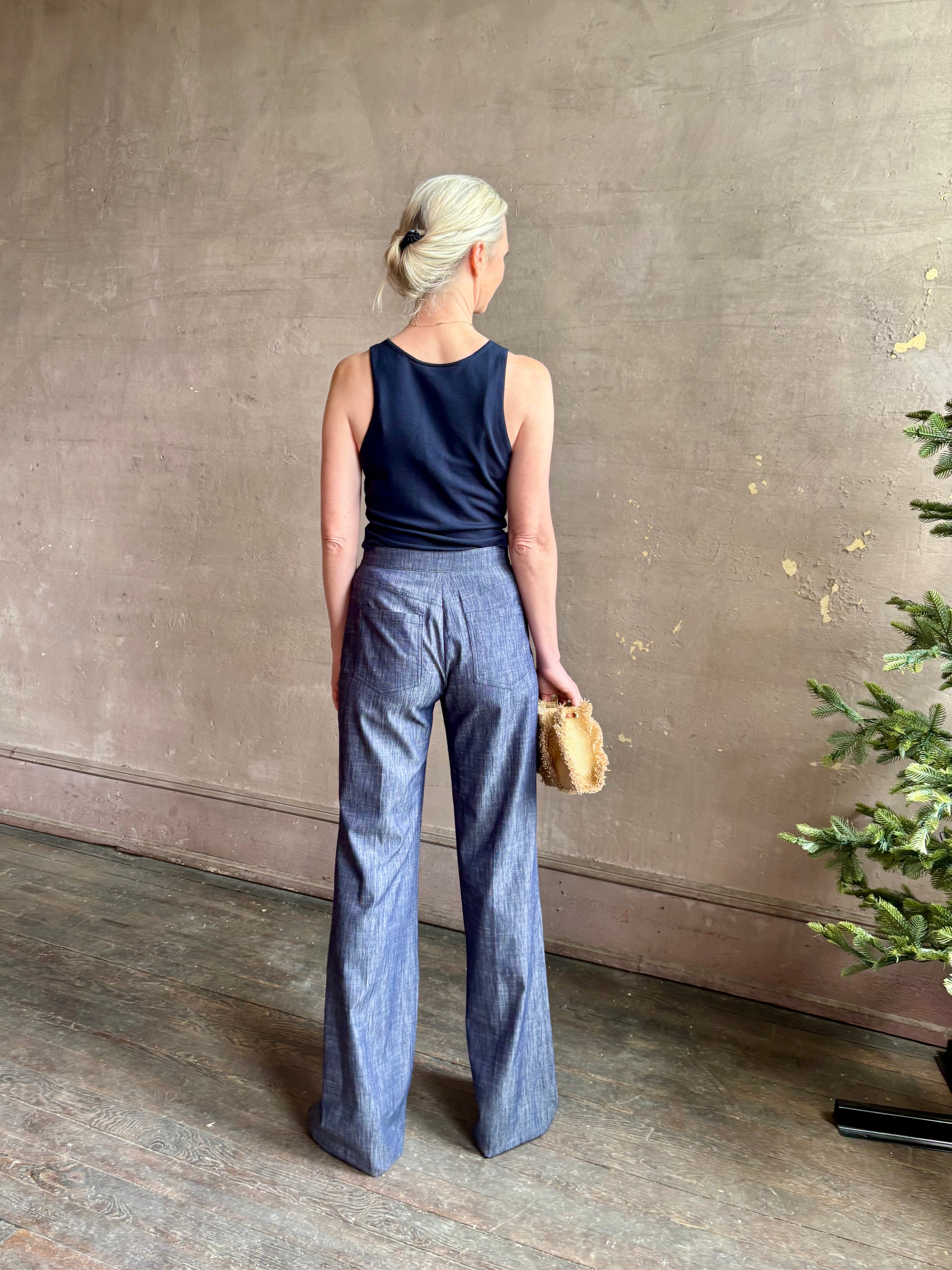 Mature woman wearing Italian designer Tonne trouser from Callas rendered in a dark indigo and crafted from a viscose, polyester, and linen blend with beautiful fluid draping and effortless versitility similar to denim