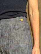 Mature woman wearing Italian designer Tonne trouser from Callas rendered in a dark indigo and crafted from a viscose, polyester, and linen blend with beautiful fluid draping and effortless versitility similar to denim