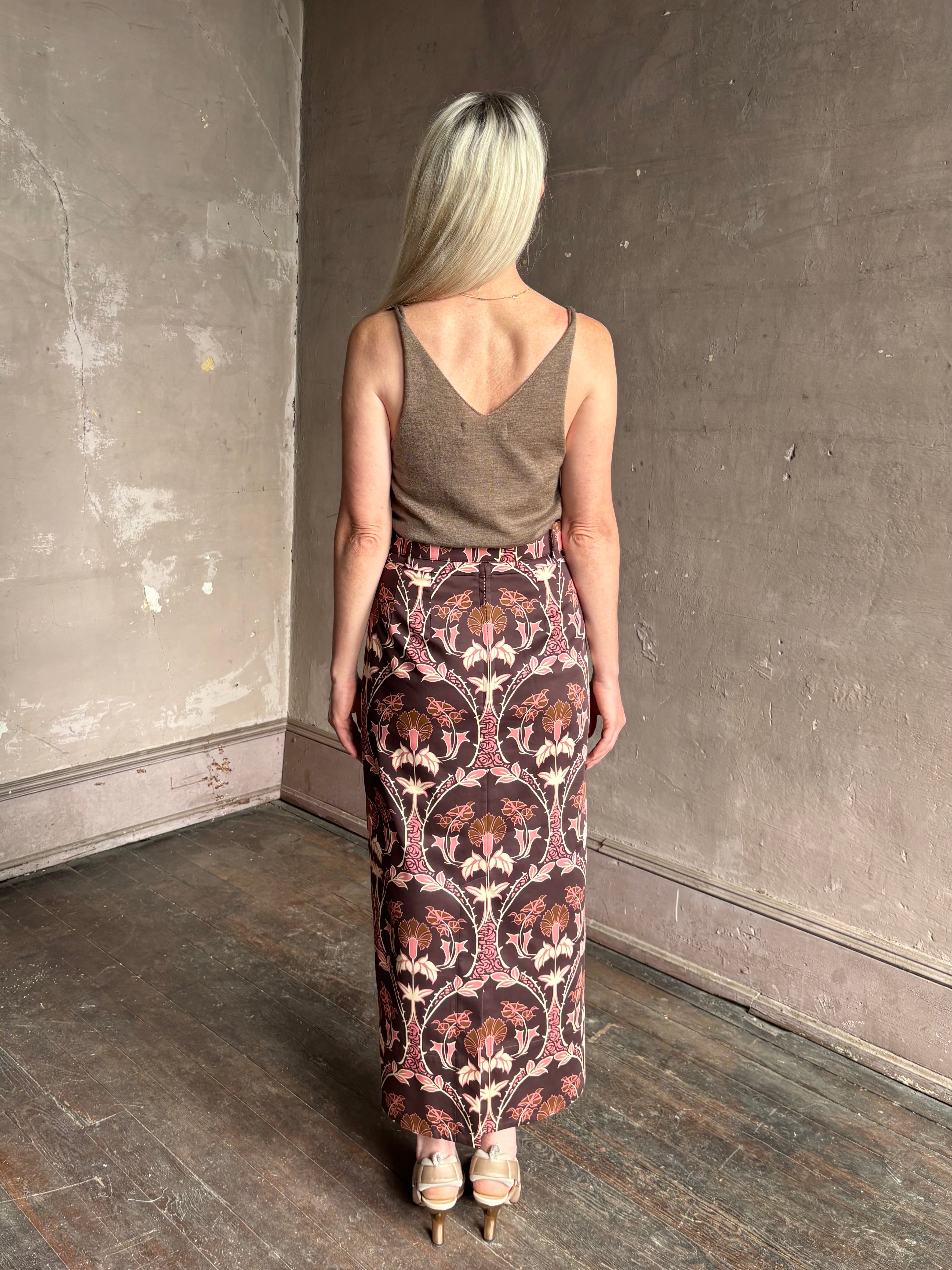 Mature woman wearing Cara Cara blaze long pencil skirt with a brown pink and beige botanical damask pattern 