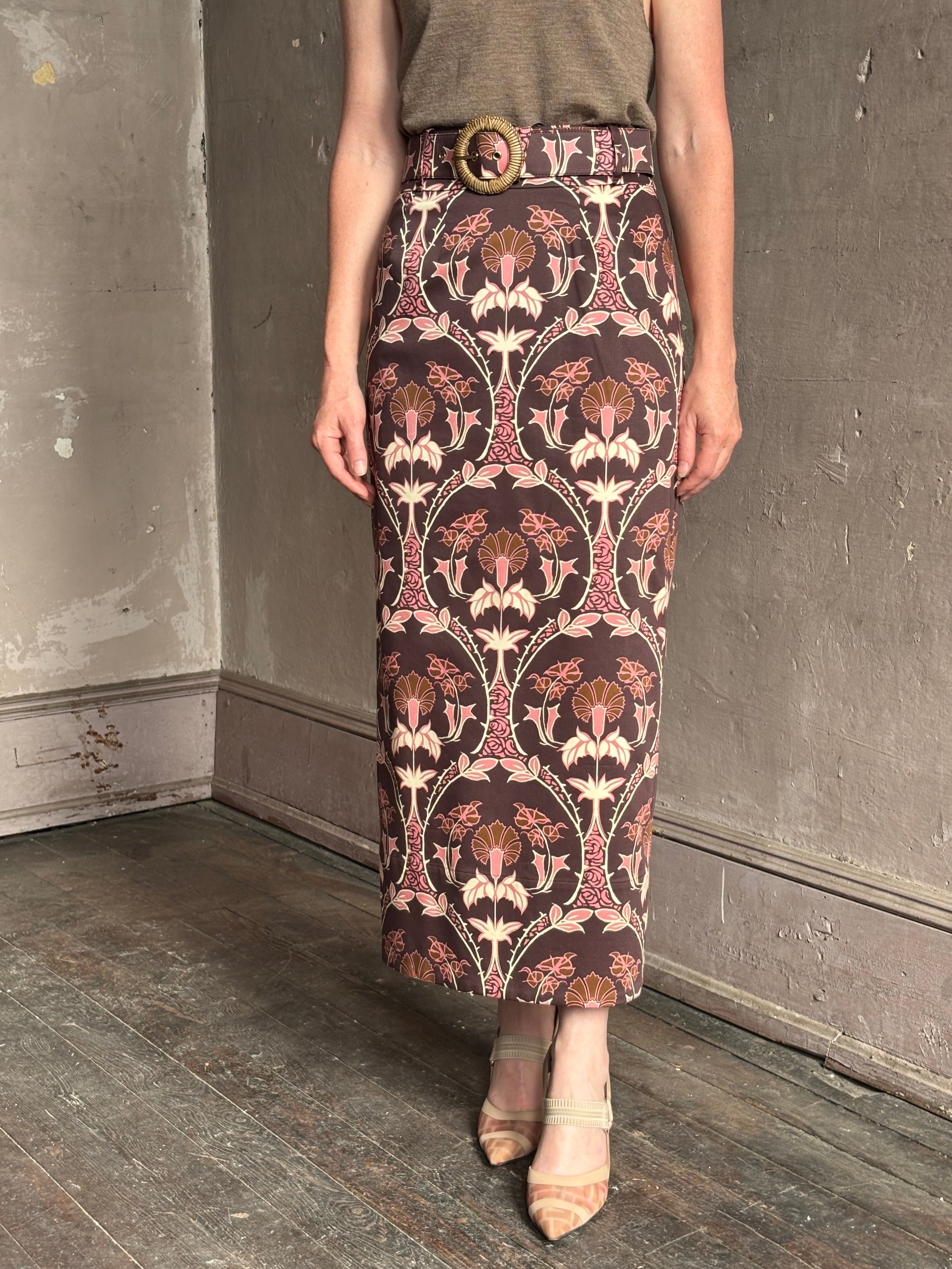 Mature woman wearing Cara Cara blaze long pencil skirt with a brown pink and beige botanical damask pattern 