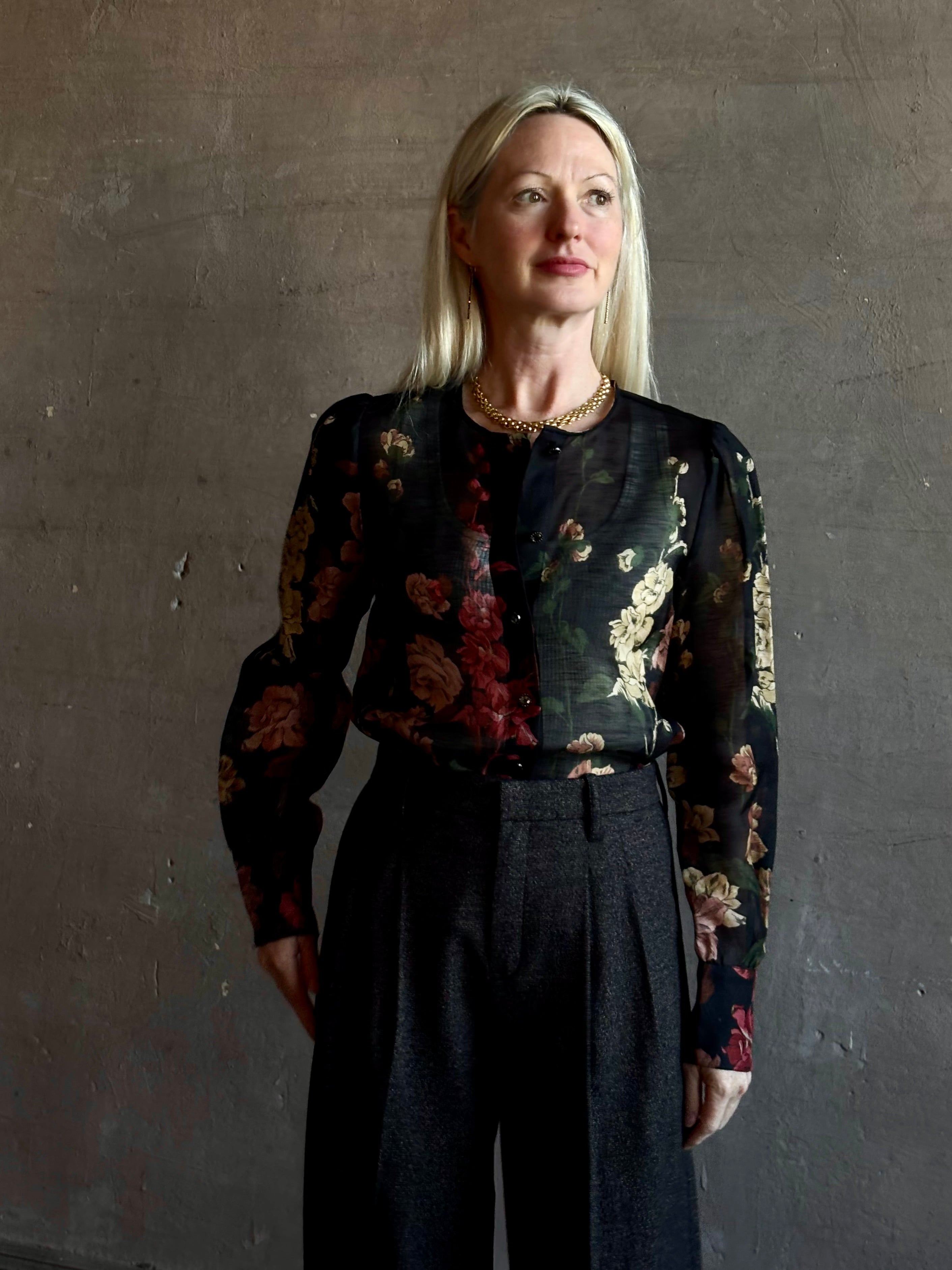 Mature woman wearing Cara Cara Chili Blouse in Meadows Black linen-silk  crystal buttons Romantic dressmaker-quality statement blouse