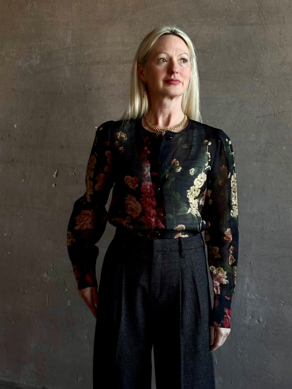 Mature woman wearing Cara Cara Chili Blouse in Meadows Black linen-silk  crystal buttons Romantic dressmaker-quality statement blouse