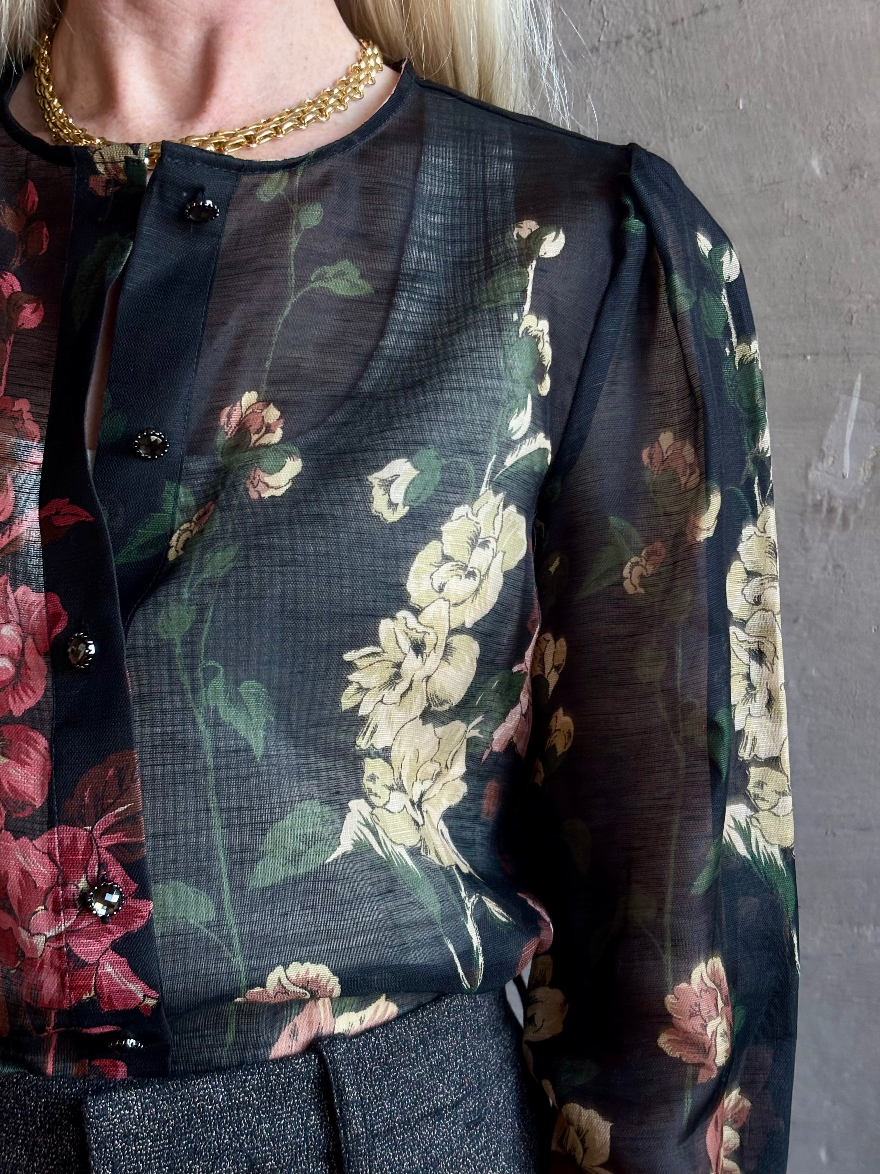 Mature woman wearing Cara Cara Chili Blouse in Meadows Black linen-silk  crystal buttons Romantic dressmaker-quality occasion ready