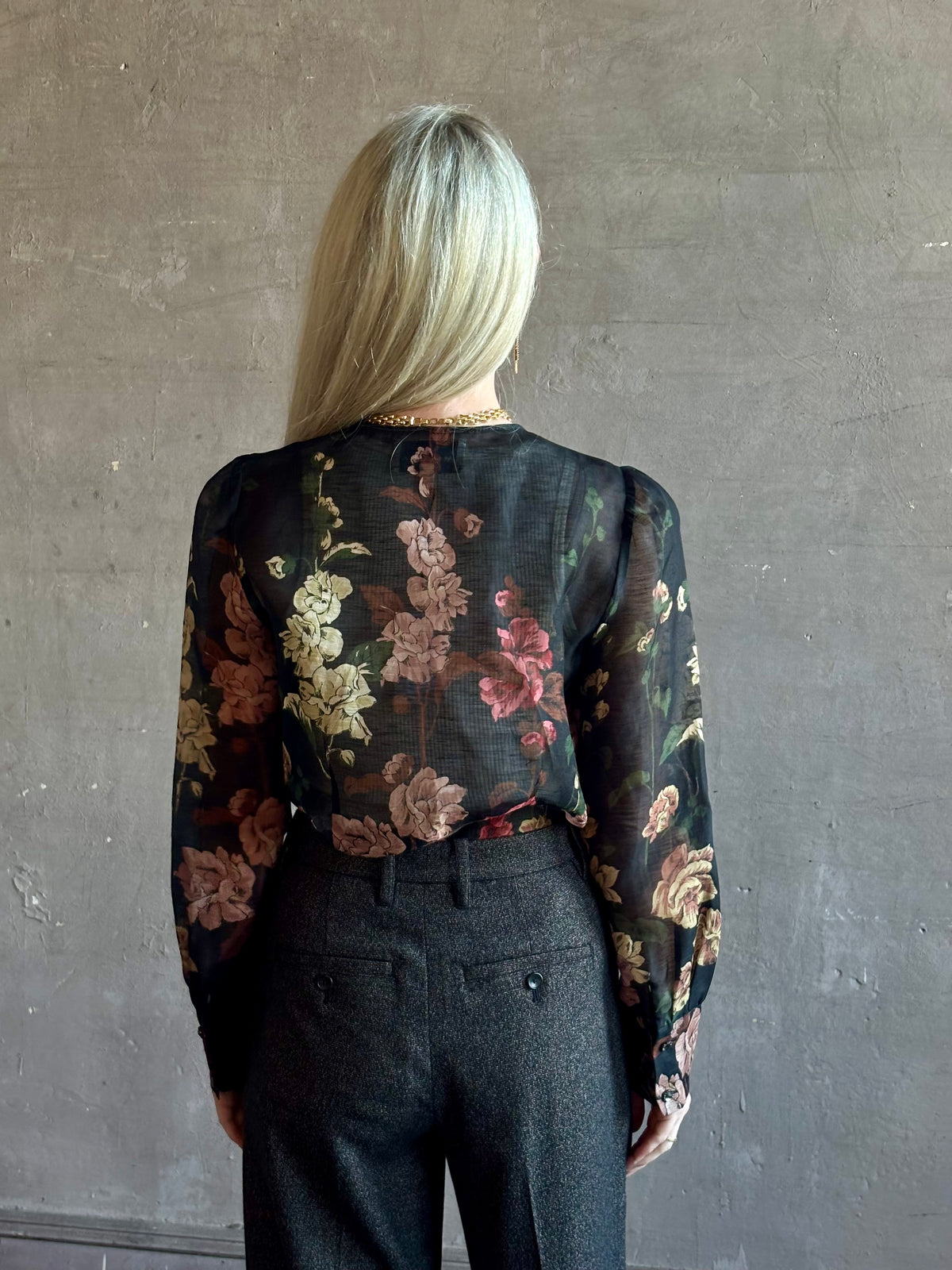 Mature woman wearing Cara Cara Chili Blouse in Meadows Black linen-silk  crystal buttons Romantic dressmaker-quality statement blouse