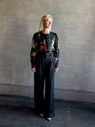 Mature woman wearing Cara Cara Chili Blouse in Meadows Black linen-silk  crystal buttons Romantic dressmaker-quality statement blouse
