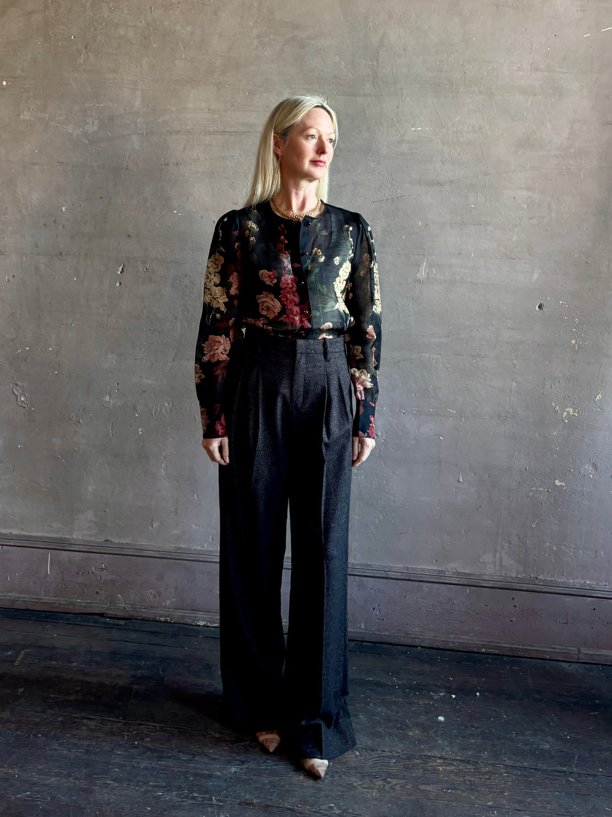 Mature woman wearing Cara Cara Chili Blouse in Meadows Black linen-silk  crystal buttons Romantic dressmaker-quality statement blouse