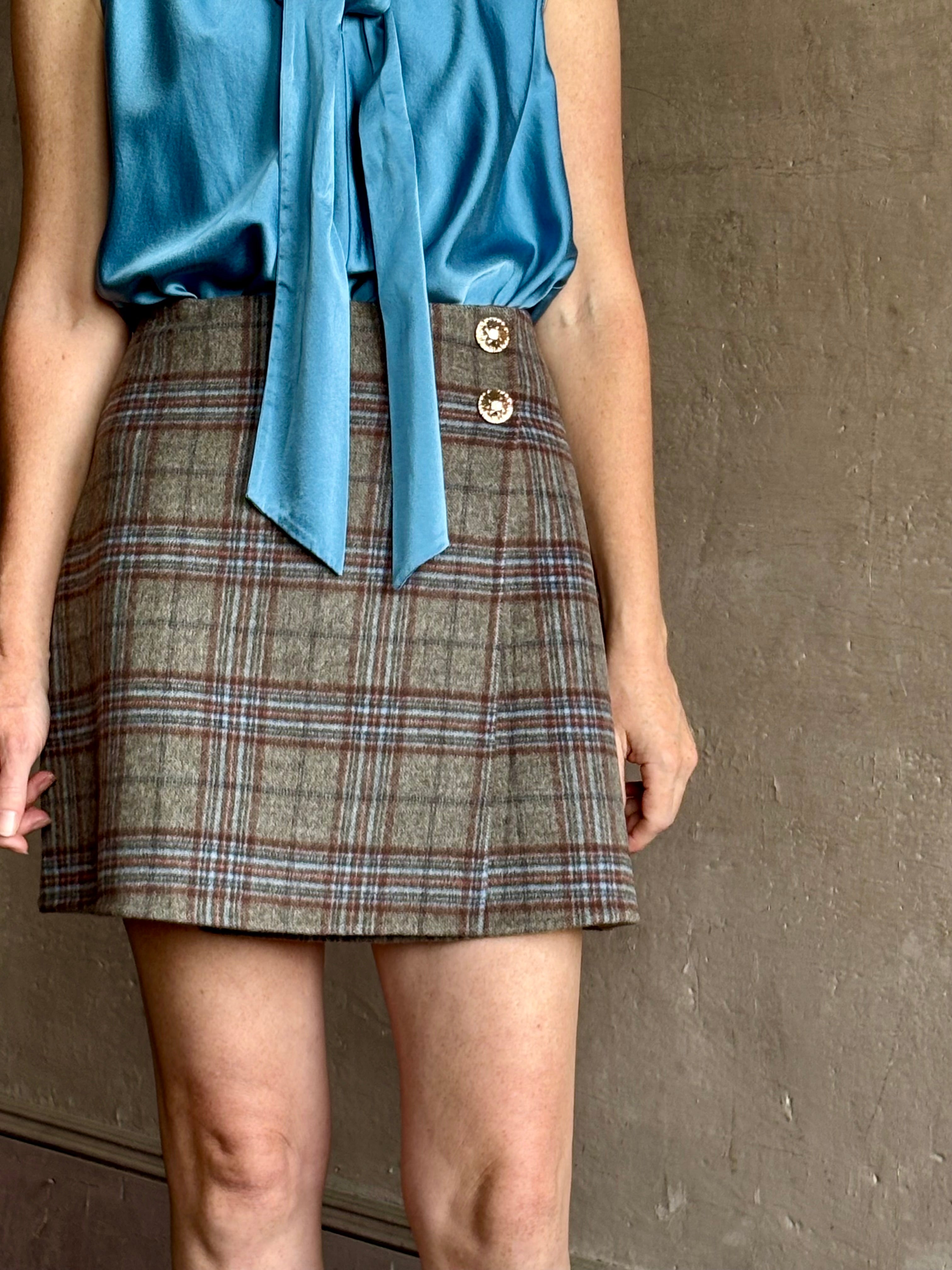 Image of woman wearing the classic Allen Plaid A-Line Mini Skirt from Cara Cara in a premium wool blend