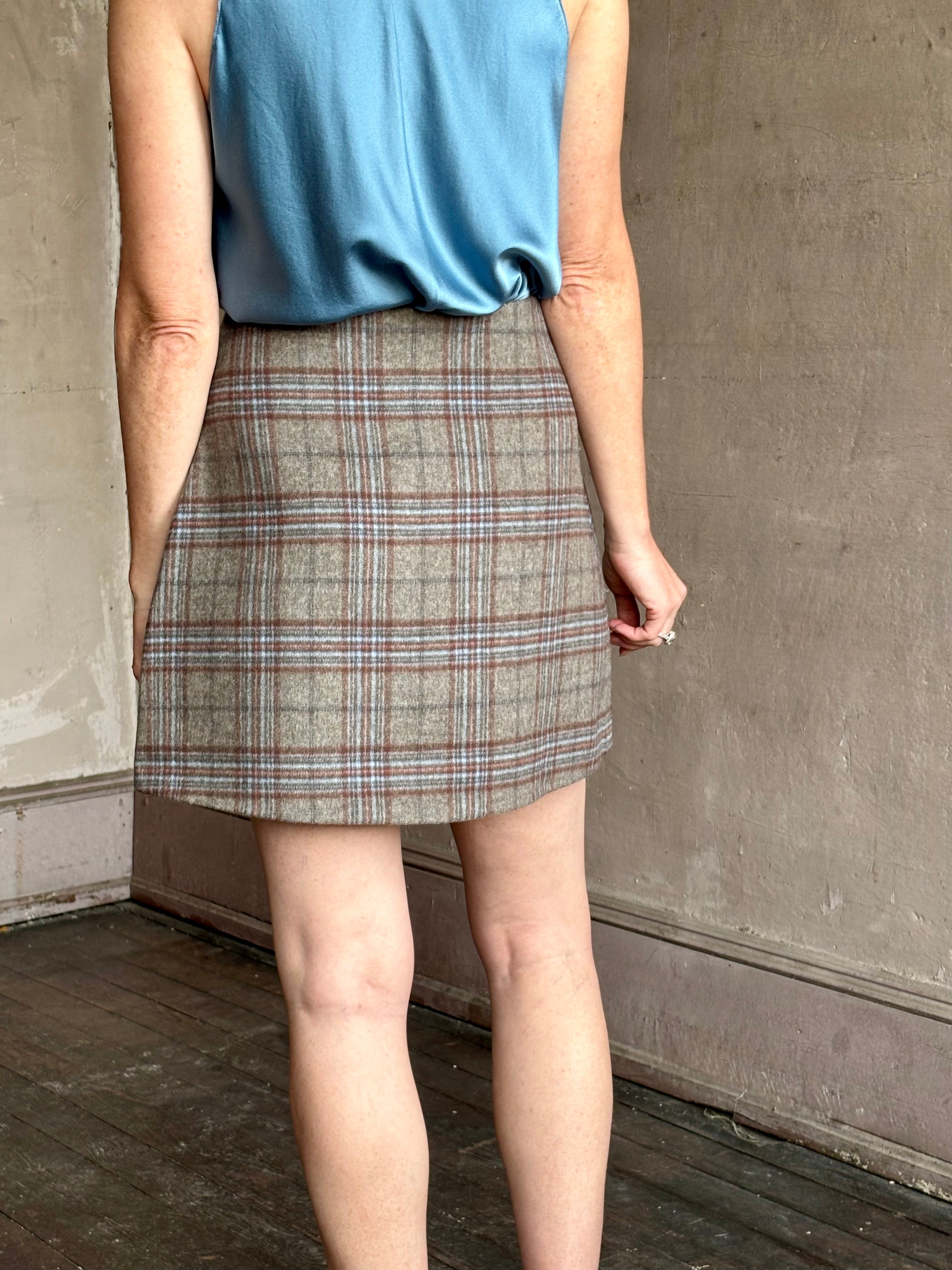 Image of woman wearing the classic Allen Plaid A-Line Mini Skirt from Cara Cara in a premium wool blend