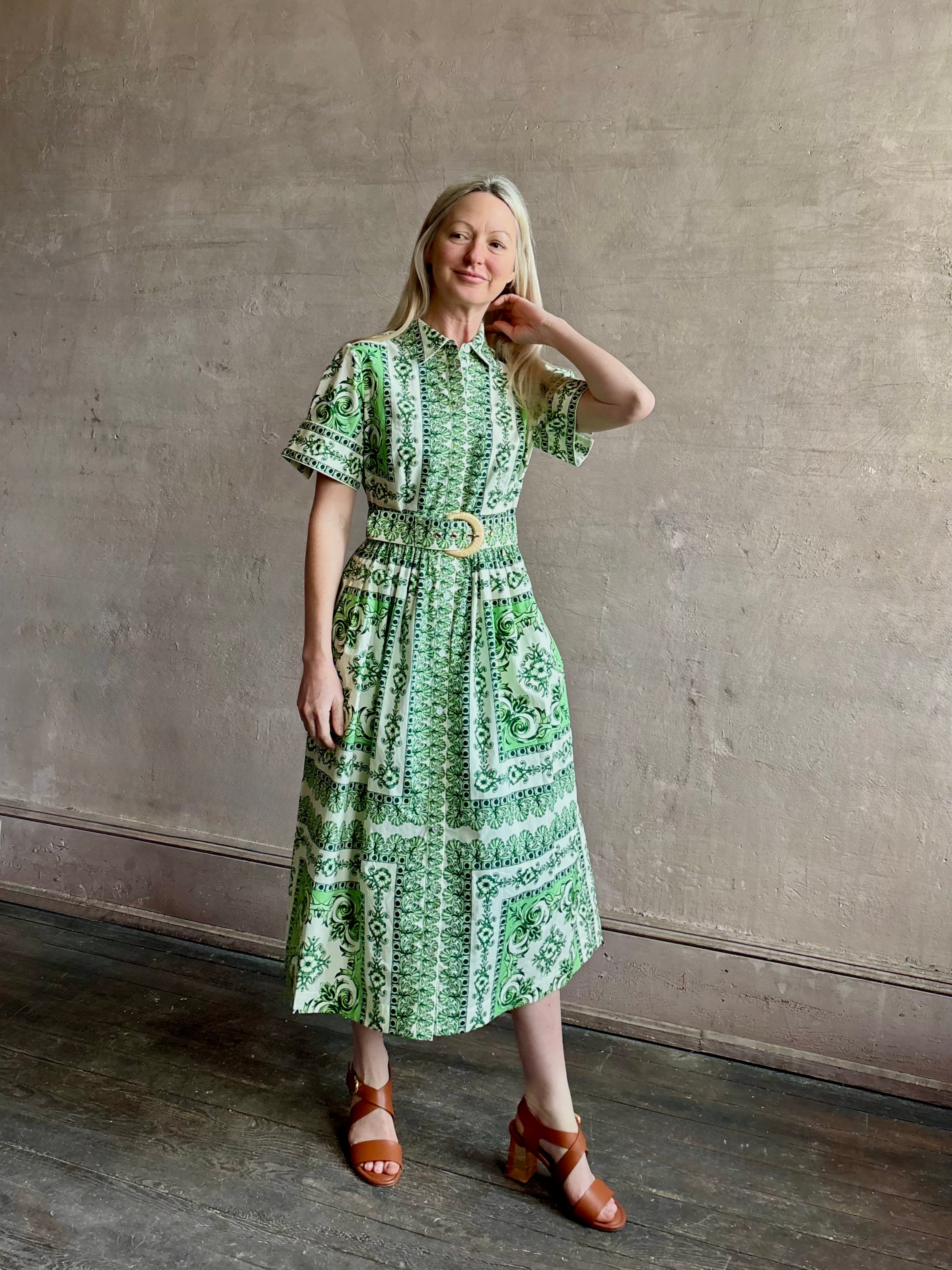 Woman wearing Cara Cara designer Malena cotton poplin shirt dress in a green Hudson Scarf Mint print with short sleeves ad belt