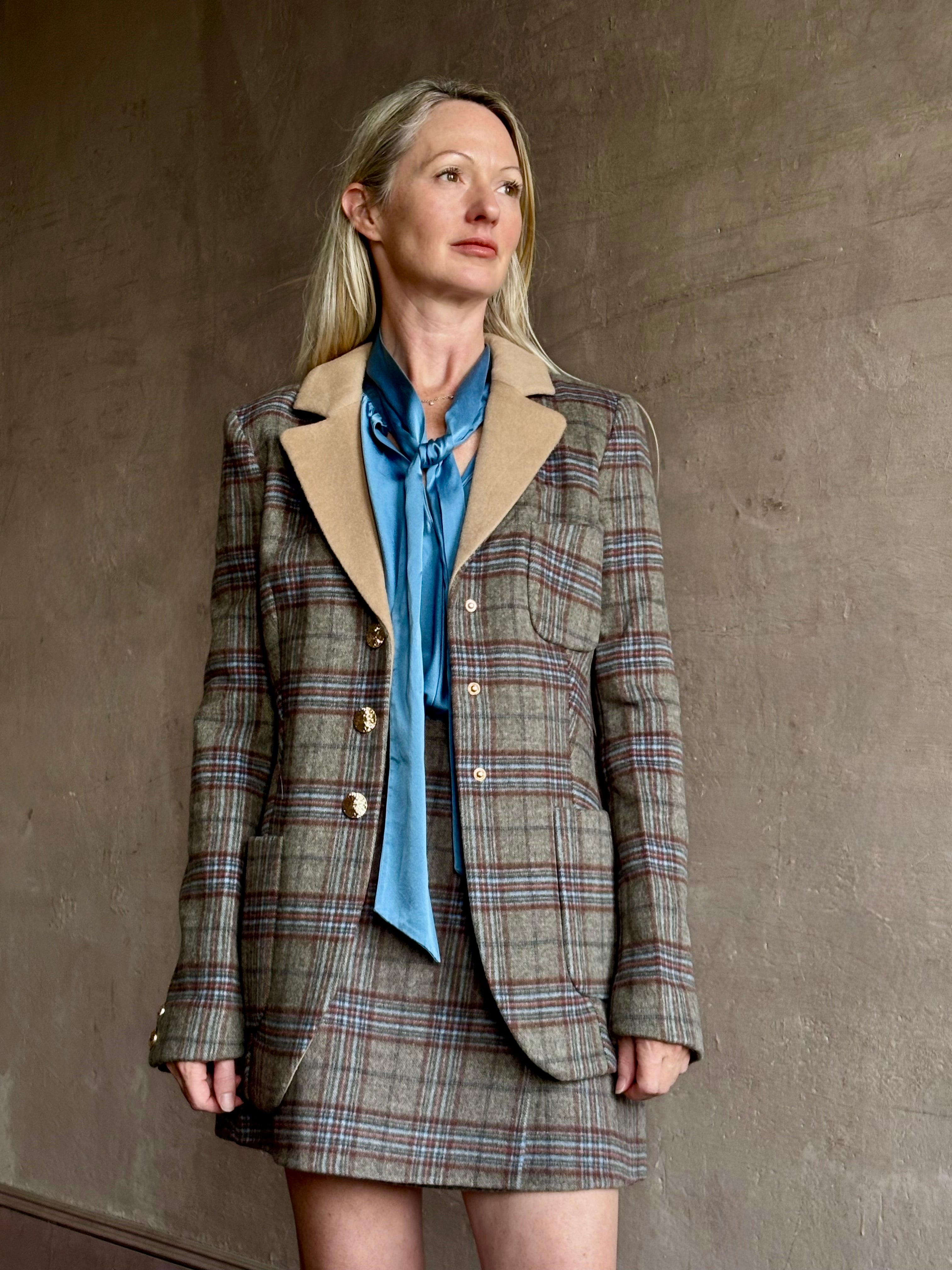 Image of woman wearing the Cara Cara Ross classic tailored Ross blazer with coordinating kitty mini skirt can be worn as a matching set 