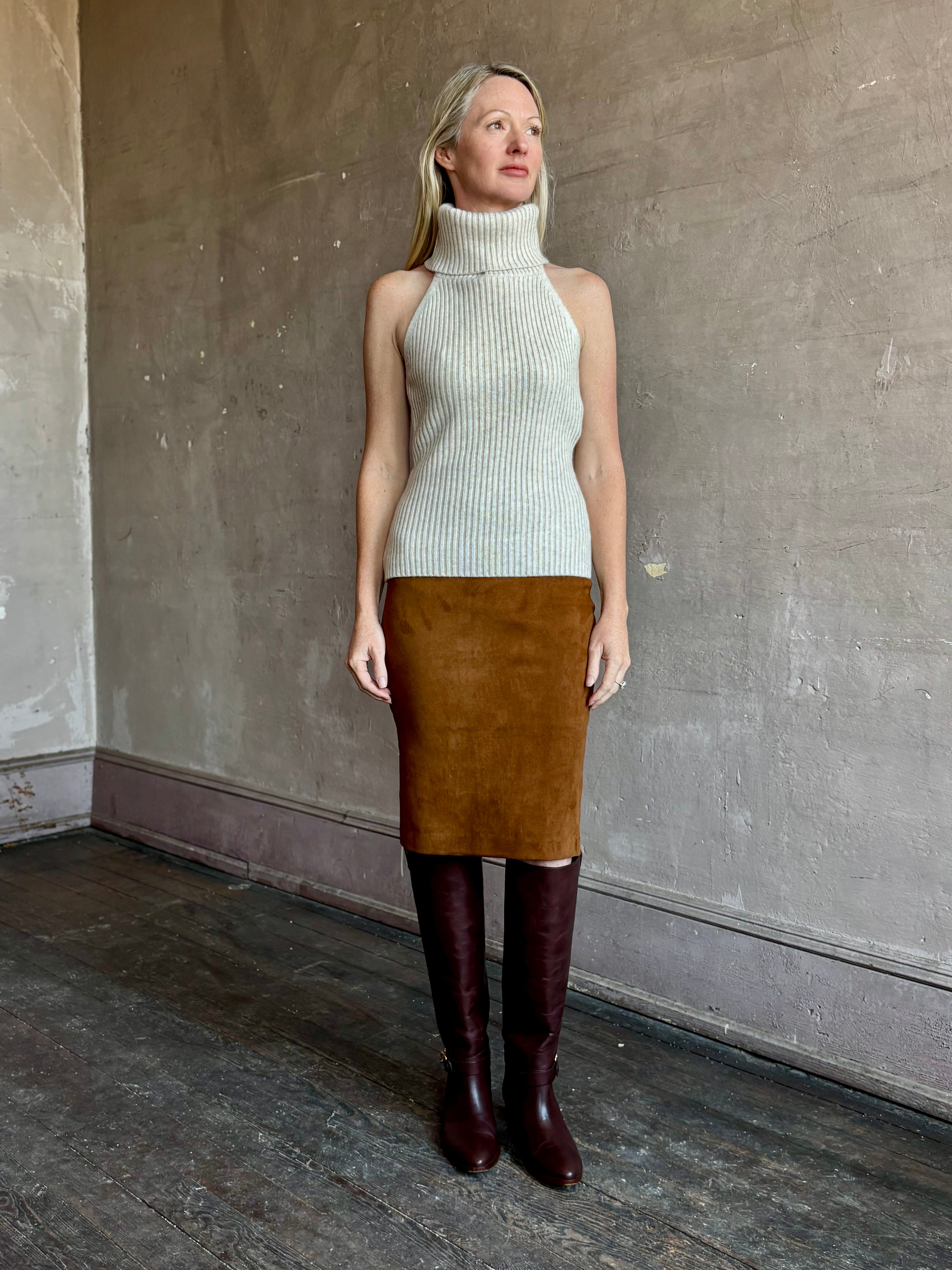 Image of mature woman wearing the Cara Cara Samson Top in neutral knit with turtleneck and halter top design in a luxury wool and cashmere blend