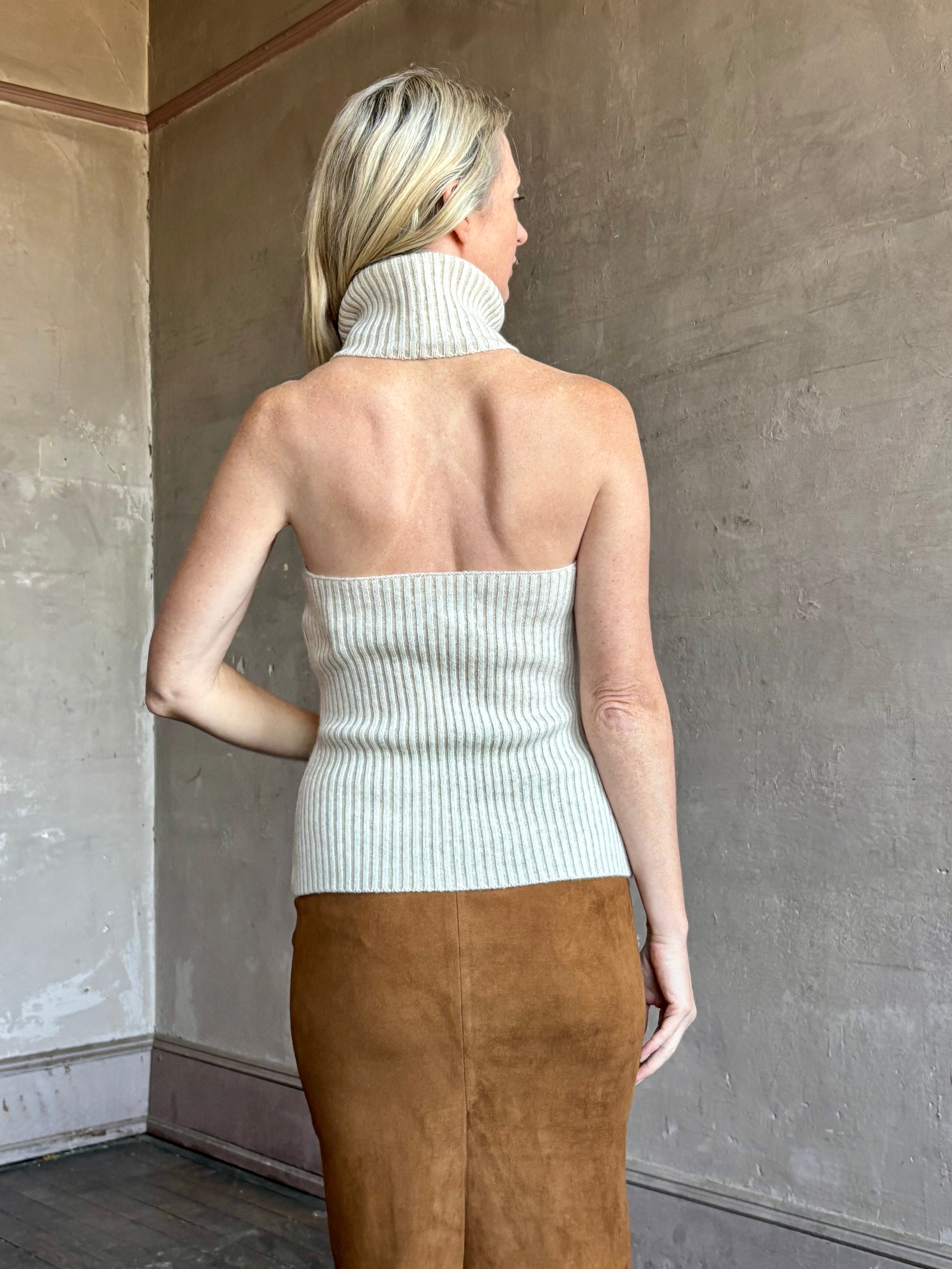 Image of mature woman wearing the Cara Cara Samson Top in neutral knit with turtleneck and halter top design in a luxury wool and cashmere blend