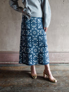 Image featuring a woman wearing the cashmere and cotton skirt by Cara Cara with a high rise and a-line fit in a beautiful knit texture in Blue Rita colorway.