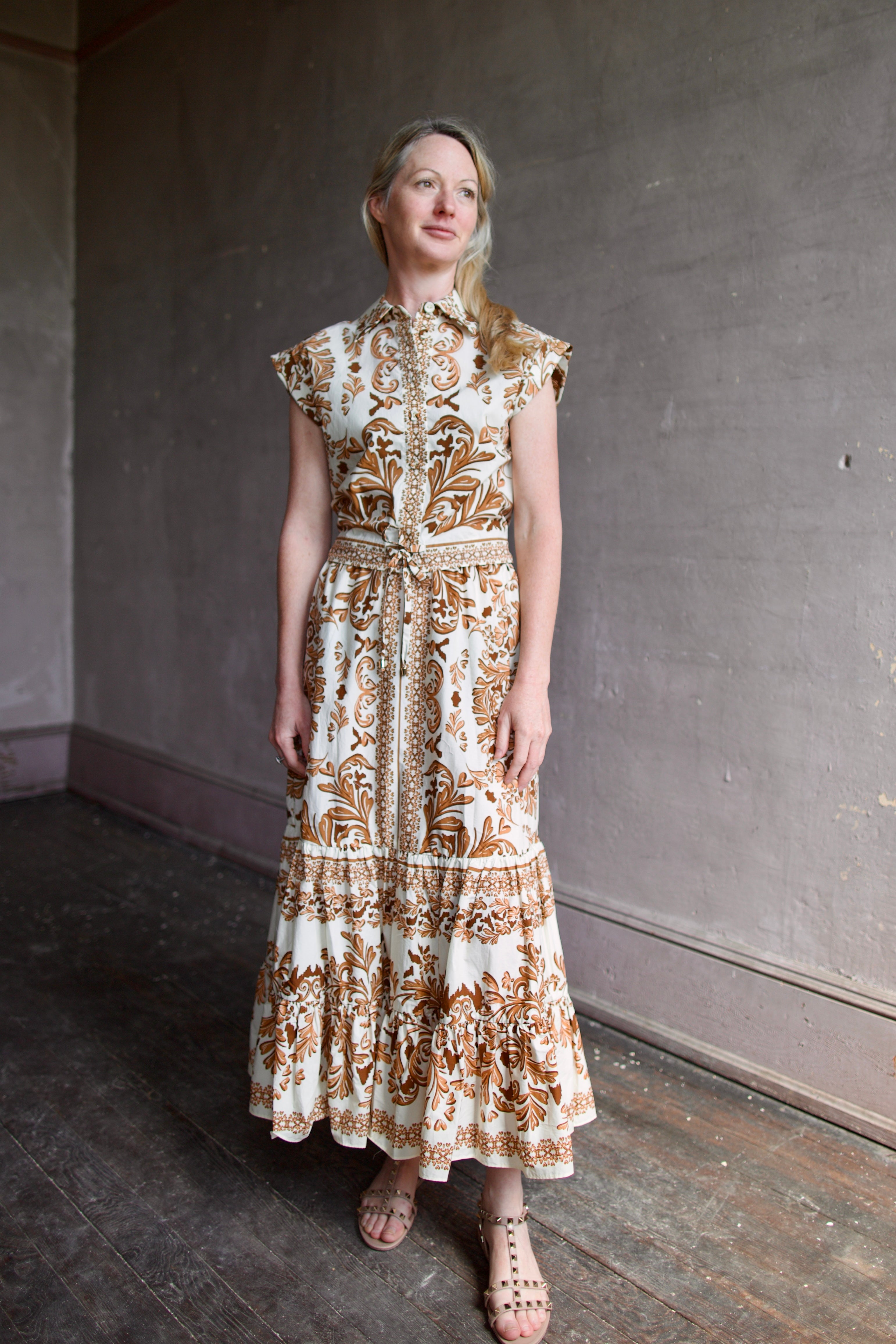 Model wearing designer Cara Cara Chase Skirt with an sophisticated tier design in neutral patterned colorway