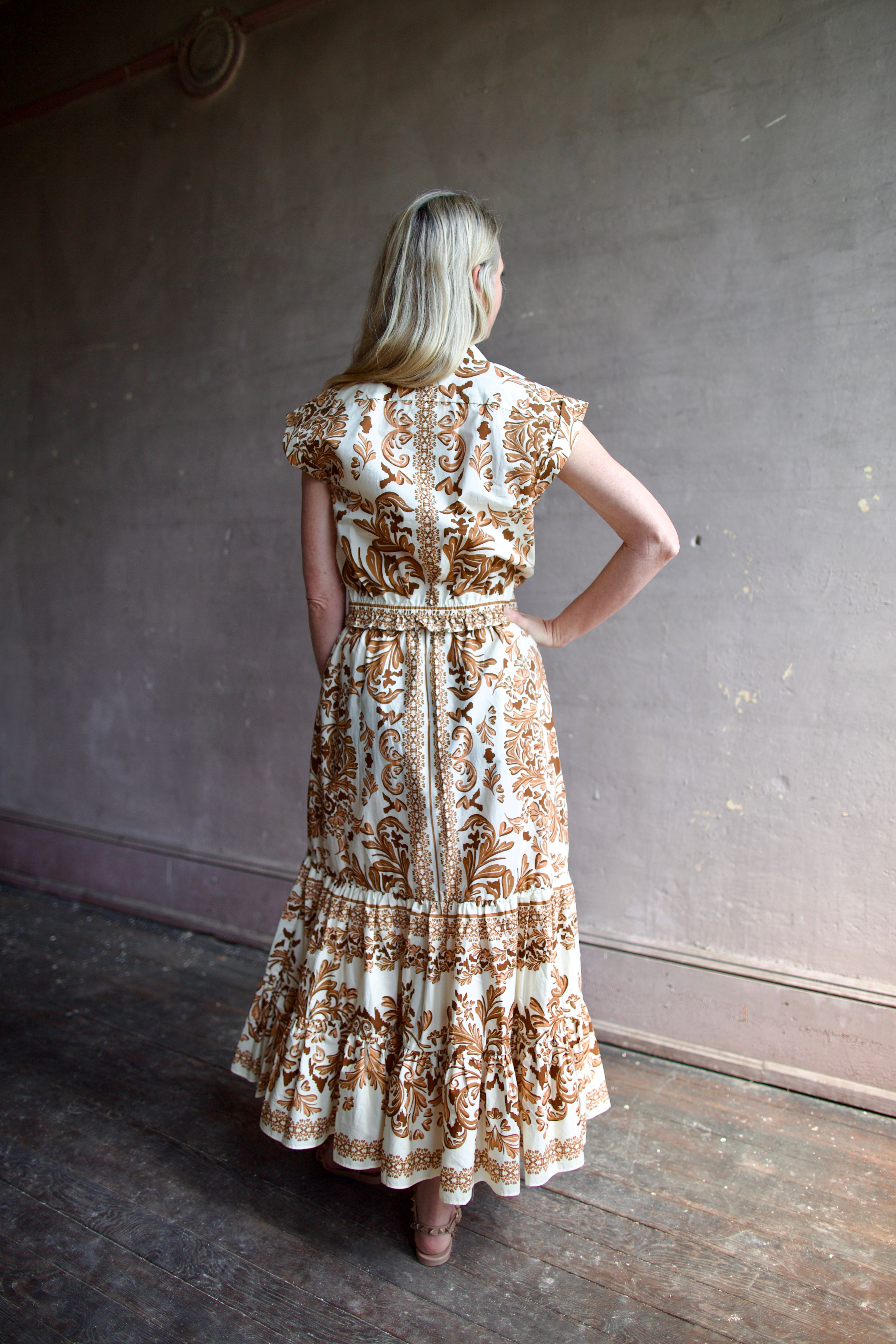 Back image of a woman wearing the Cara Cara Octavia Top and Chase Skirt