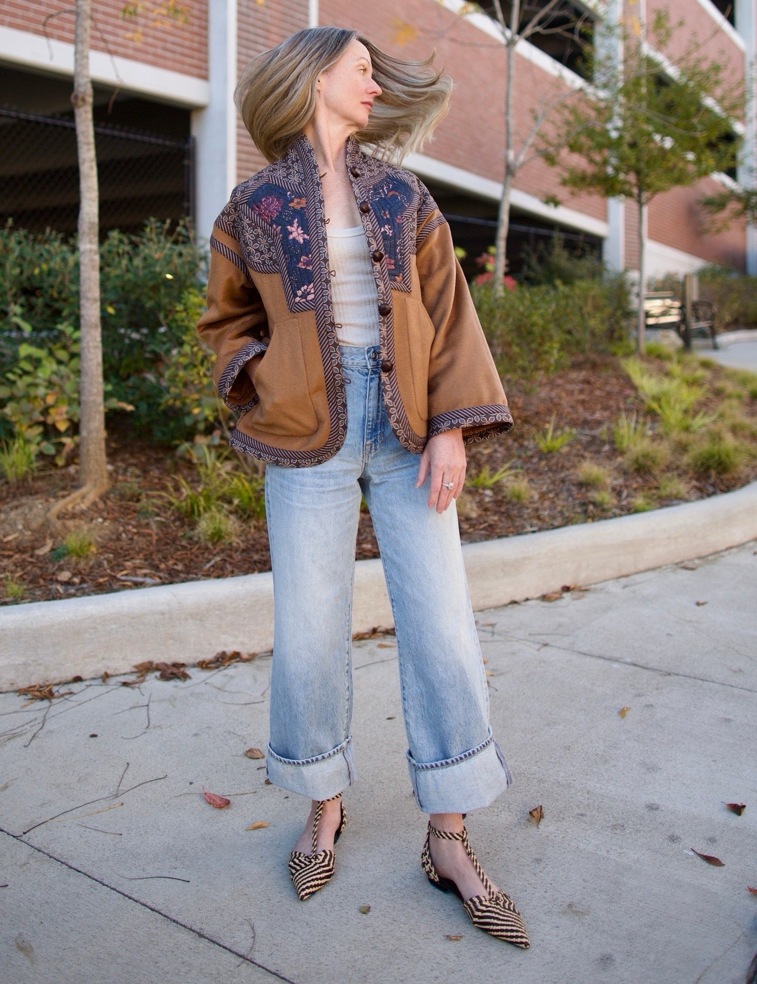 Image of a woman wearing the Cara Cara Ford Jacket, Enza Costa Ribbed Tank, Ulla Johnson Daria Flats and the slvrlake grace jeans