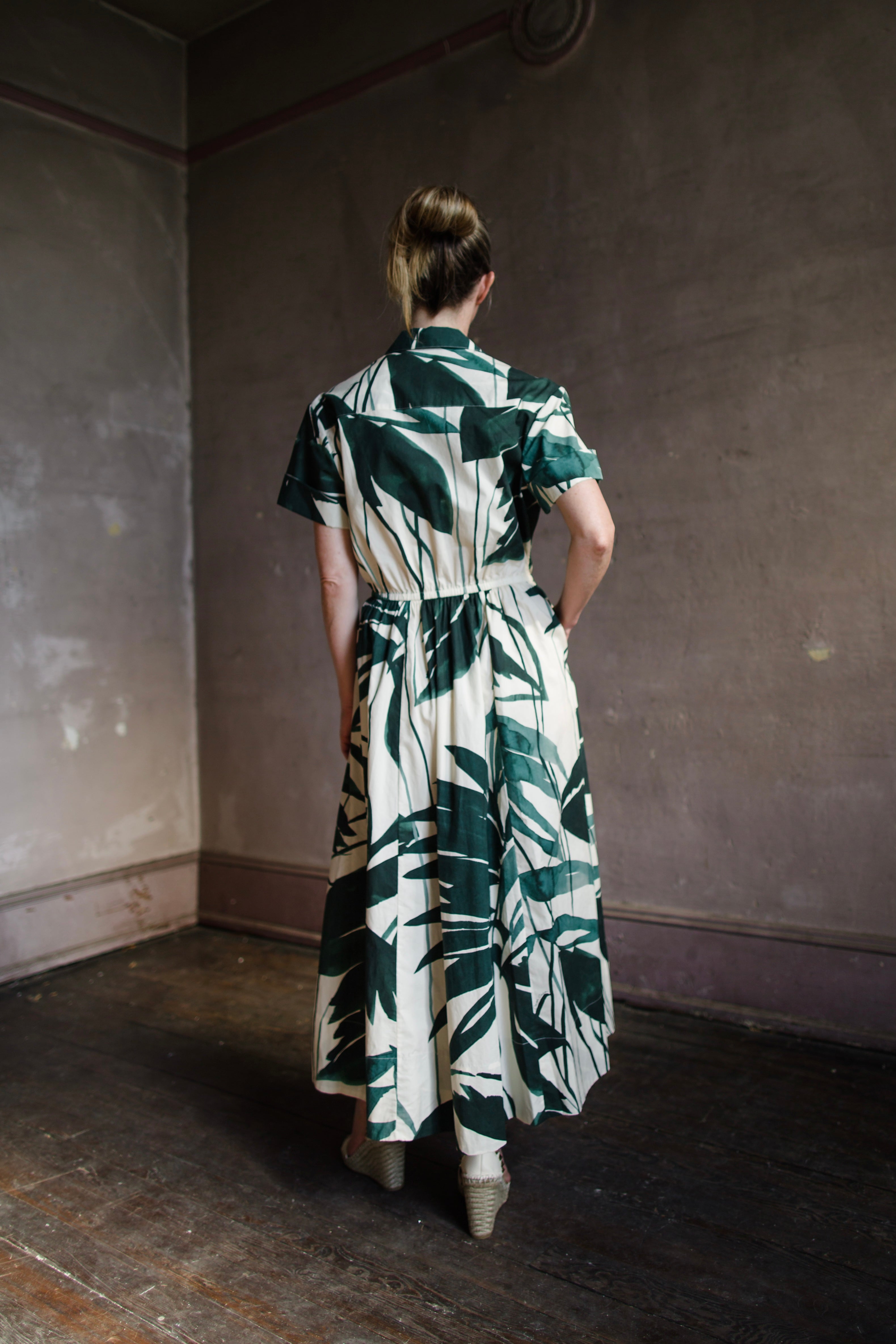 Image featuring a woman wearing the Asbury classic shirtdress from Cara Cara with a self-tie waist, short sleeves, side seam pockets, circle skirt, A-line silhouette, tea length.