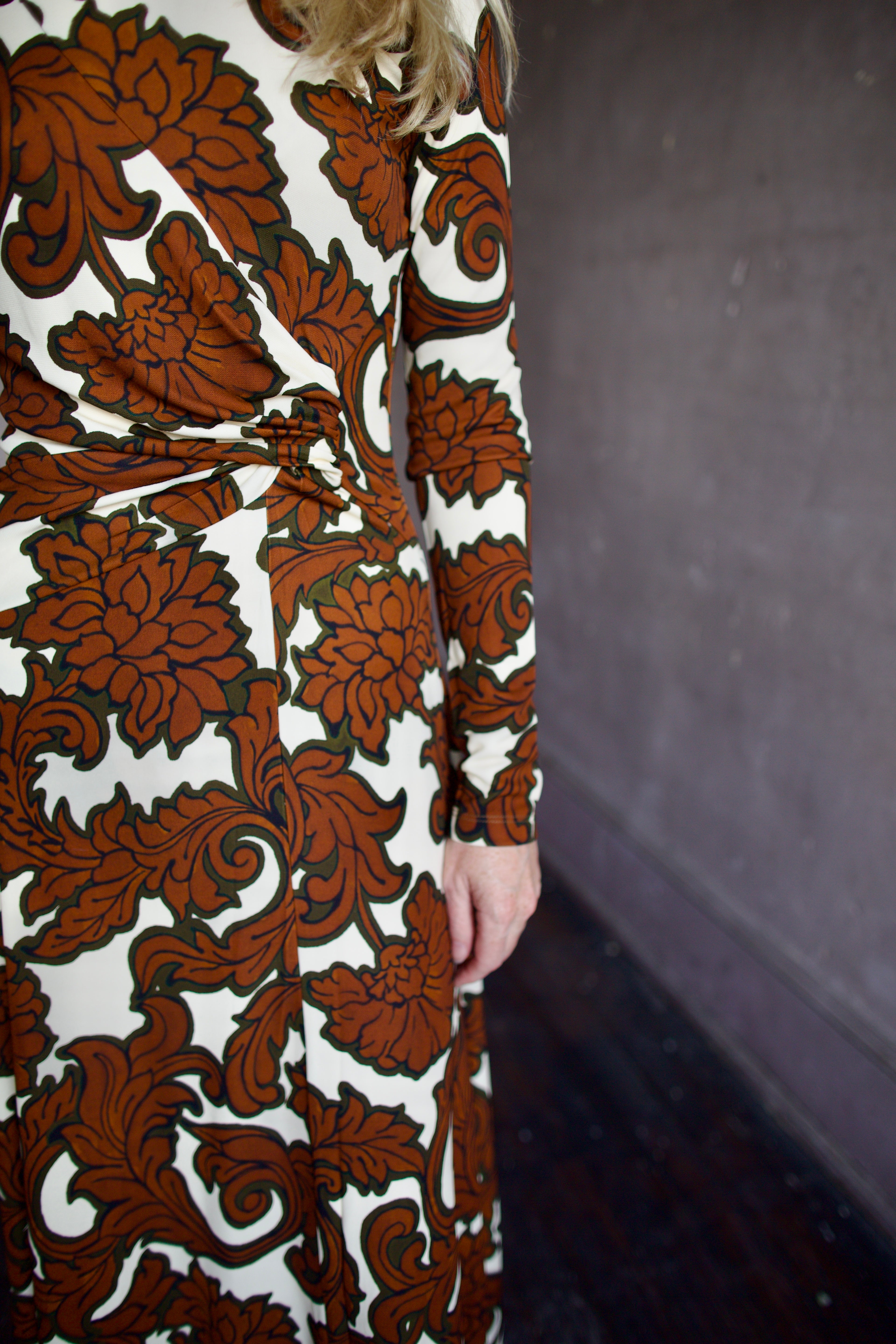 Model wearing the sophisticated patterned Hera dress by Cara Cara with a flattering A-line silhouette